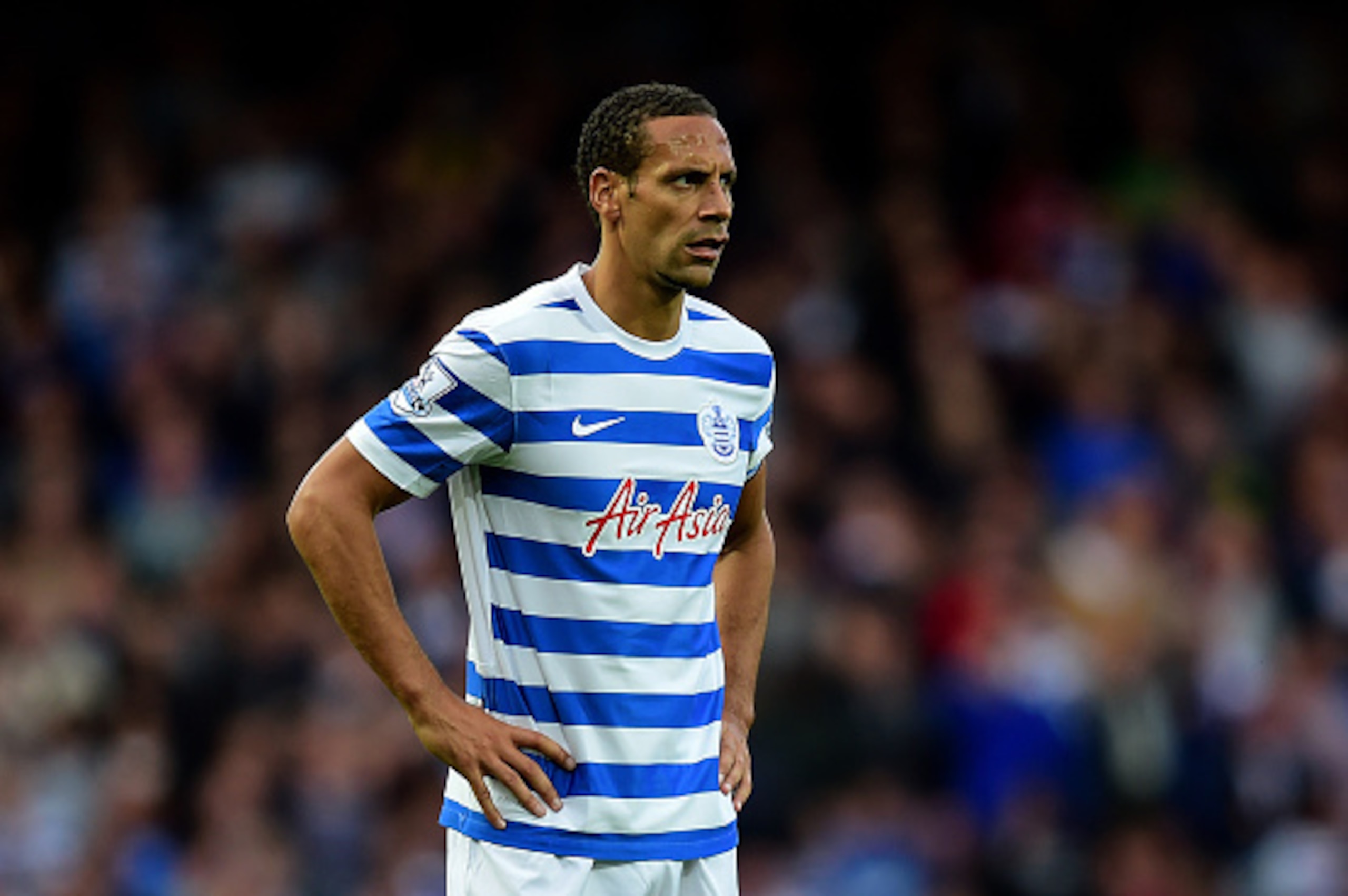 LONDON, ENGLAND - OCTOBER 05:  Rio Ferdinand of QPR reacts during the Barclays Premier League match between West Ham United and Queens Park Rangers at Boleyn Ground on October 5, 2014 in London, England.  (Photo by Jamie McDonald/Getty Images)