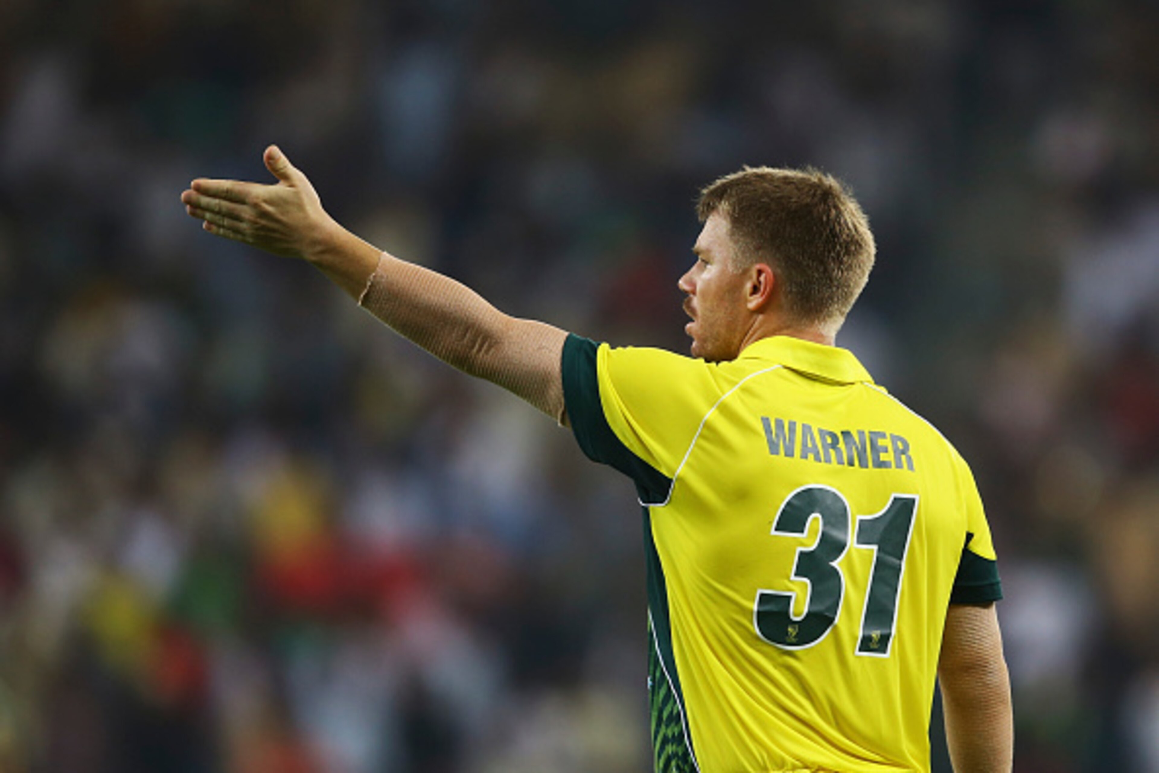 DUBAI, UNITED ARAB EMIRATES - OCTOBER 05:David Warner of Australia reacts  during the International T20 match between Australia and Pakistan at Dubai Sports City Cricket Stadium on October 5, 2014 in Dubai, United Arab Emirates.  (Photo by Francois Nel/Ge