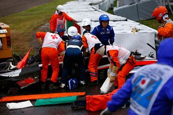 SUZUKA, JAPAN - OCTOBER 05:  Jules Bianchi of France and Marussia receives urgent medical treatment after crashing during the Japanese Formula One Grand Prix at Suzuka Circuit on October 5, 2014 in Suzuka, Japan.  (Photo by Getty Images/Getty Images)