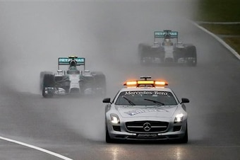 The race started behind the safety car due to heavy rain.