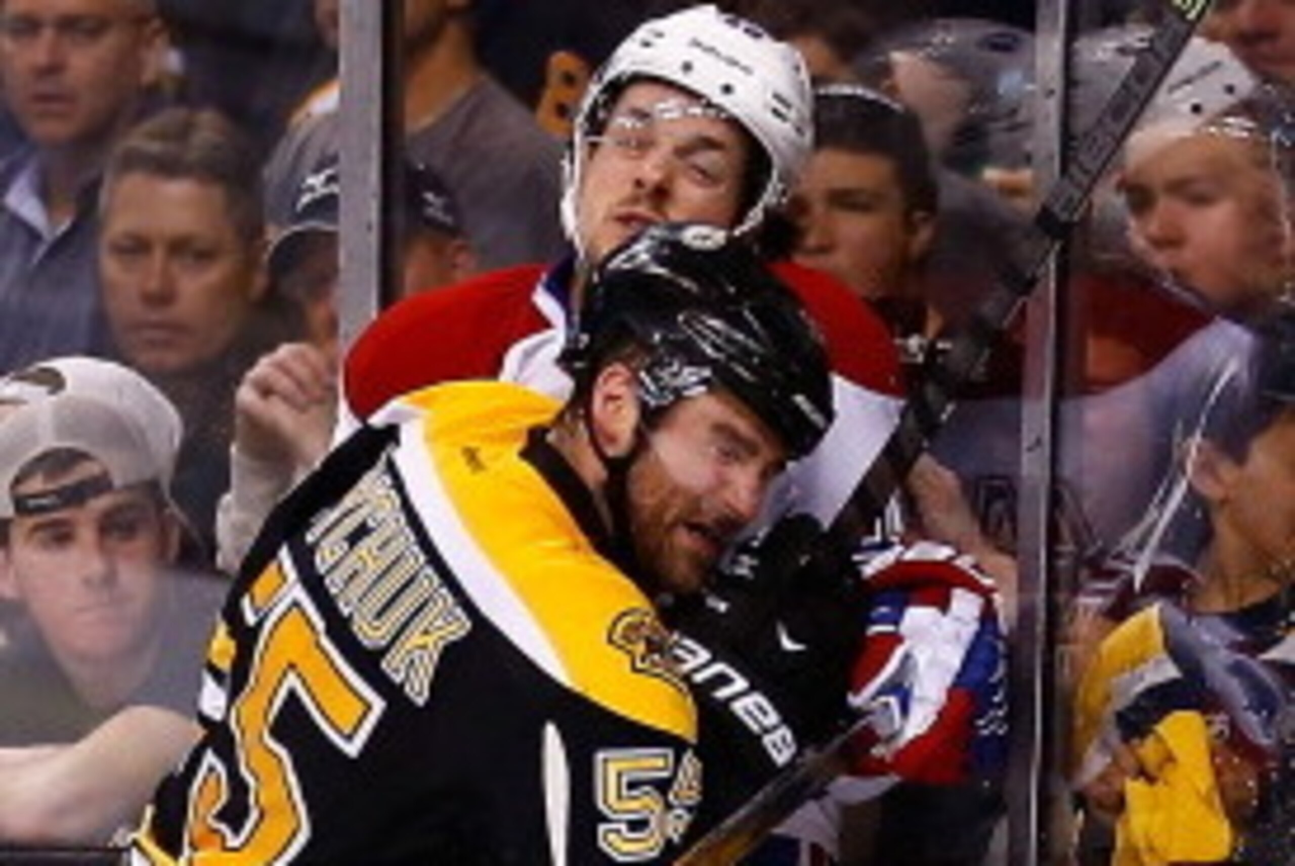 BOSTON, MA - MAY 01: Johnny Boychuk #55 of the Boston Bruins hits Daniel Briere  #48 of the Montreal Canadiens the first overtime in Game One of the Second Round of the 2014 NHL Stanley Cup Playoffs on May 1, 2014 in Boston, Massachusetts.  (Photo by Jare