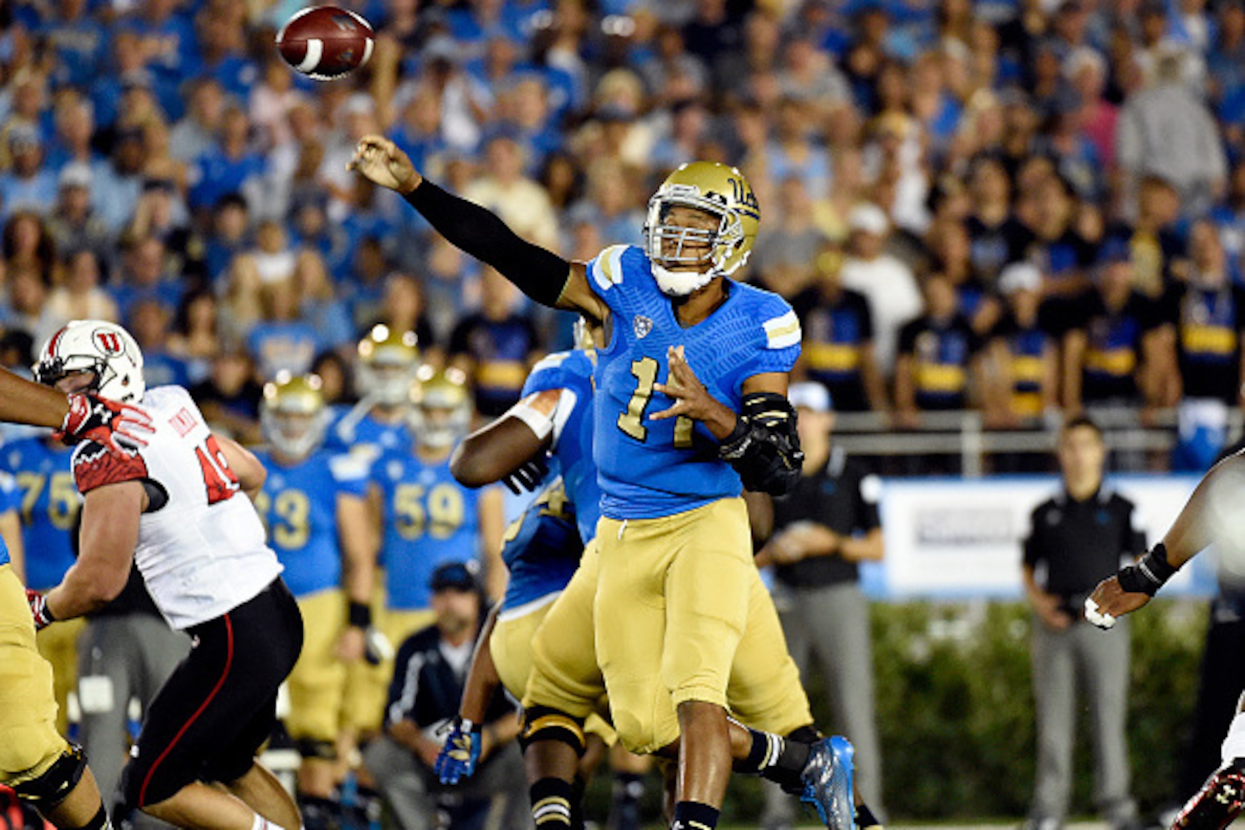 PASADENA, CA - OCTOBER 04:  Brett Hundley #17 quarterback of the UCLA Bruins  throws a pass against Utah Utes during the first half at the Rose Bowl October 04, 2014, in Pasadena, California. (Photo by Kevork Djansezian/Getty Images)