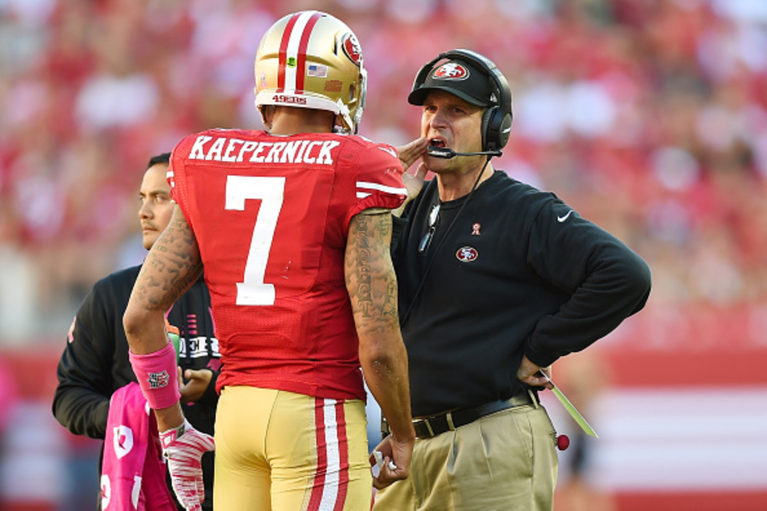 SANTA CLARA, CA - OCTOBER 05: Head coach Jim Harbaugh of the San Francisco 49ers talks with quarterback Colin Kaepernick #7 during a timeout late in the fourth quarter against the Kansas City Chiefs at Levi's Stadium on October 5, 2014 in Santa Clara, Ca SANTA CLARA, CA - OCTOBER 05: Head coach Jim Harbaugh of the San Francisco 49ers talks with quarterback Colin Kaepernick #7 during a timeout late in the fourth quarter against the Kansas City Chiefs at Levi's Stadium on October 5, 2014 in Santa Clara, Ca