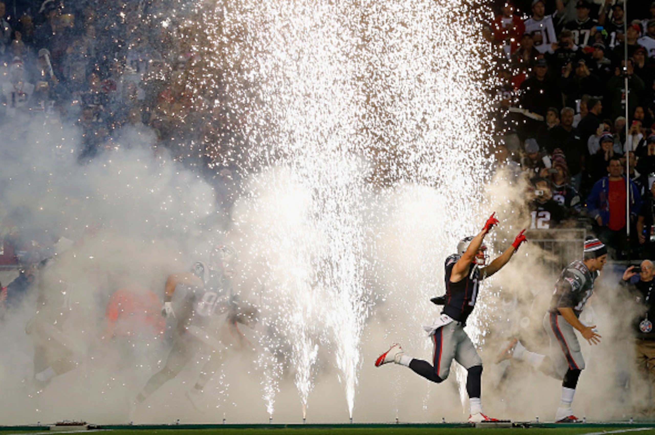 FOXBORO, MA - OCTOBER 05: Julian Edelman #11 and Tom Brady #12 of the New England Patriots run onto the field before a game against the Cincinnati Bengals at Gillette Stadium on October 5, 2014 in Foxboro, Massachusetts. (Photo by Jim Rogash/Getty Image FOXBORO, MA - OCTOBER 05: Julian Edelman #11 and Tom Brady #12 of the New England Patriots run onto the field before a game against the Cincinnati Bengals at Gillette Stadium on October 5, 2014 in Foxboro, Massachusetts. (Photo by Jim Rogash/Getty Image