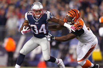 FOXBORO, MA - OCTOBER 05:  Shane Vereen #34 of the New England Patriots carries the ball during the third quarter as Geno Atkins #97 of the Cincinnati Bengals makes a tackle at Gillette Stadium on October 5, 2014 in Foxboro, Massachusetts.  (Photo by Jim 