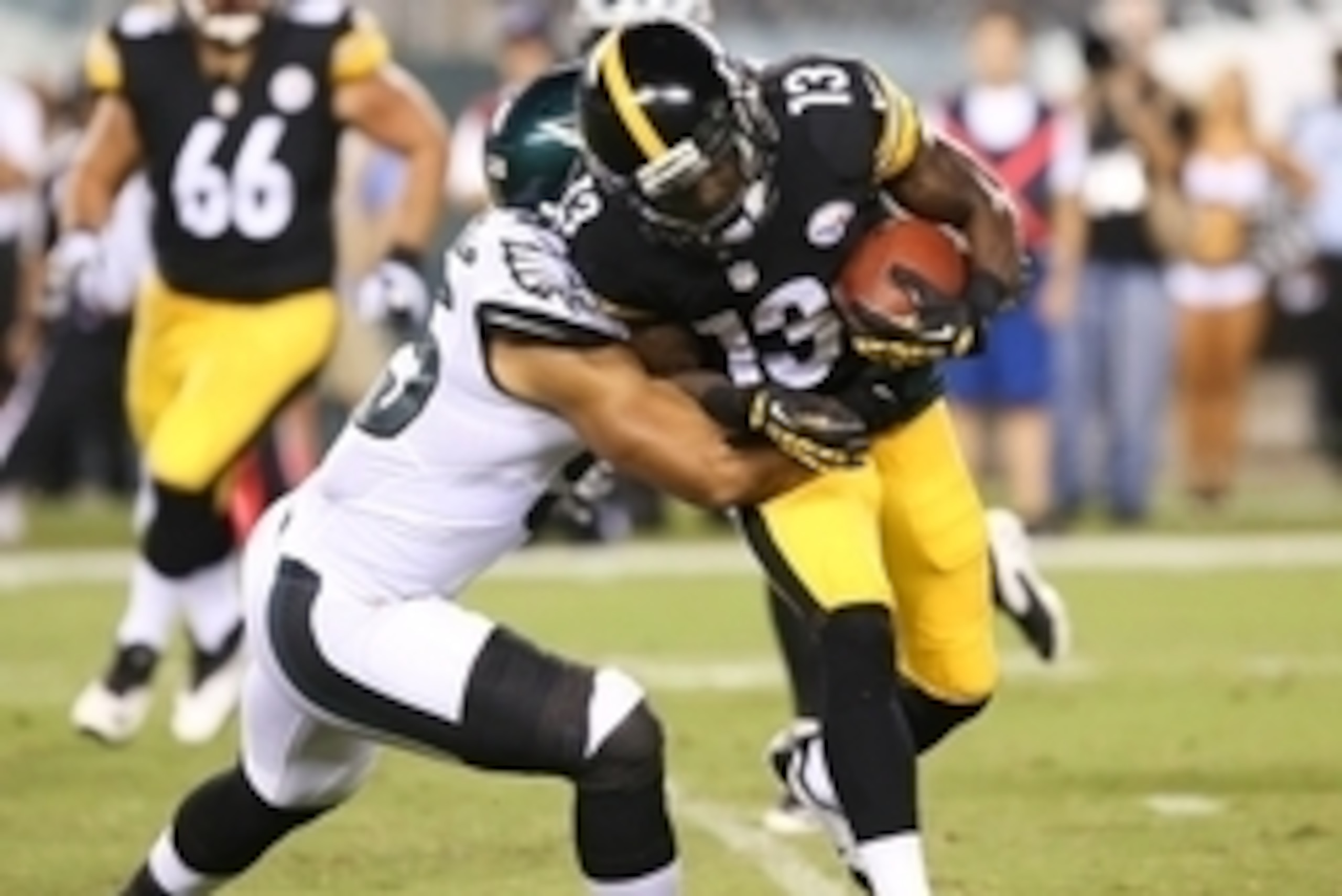 Aug 21, 2014; Philadelphia, PA, USA; Pittsburgh Steelers running back Dri Archer (13) runs with the ball and is tackled by Philadelphia Eagles inside linebacker Mychal Kendricks (95) during the second quarter of a game at Lincoln Financial Field. Mandator