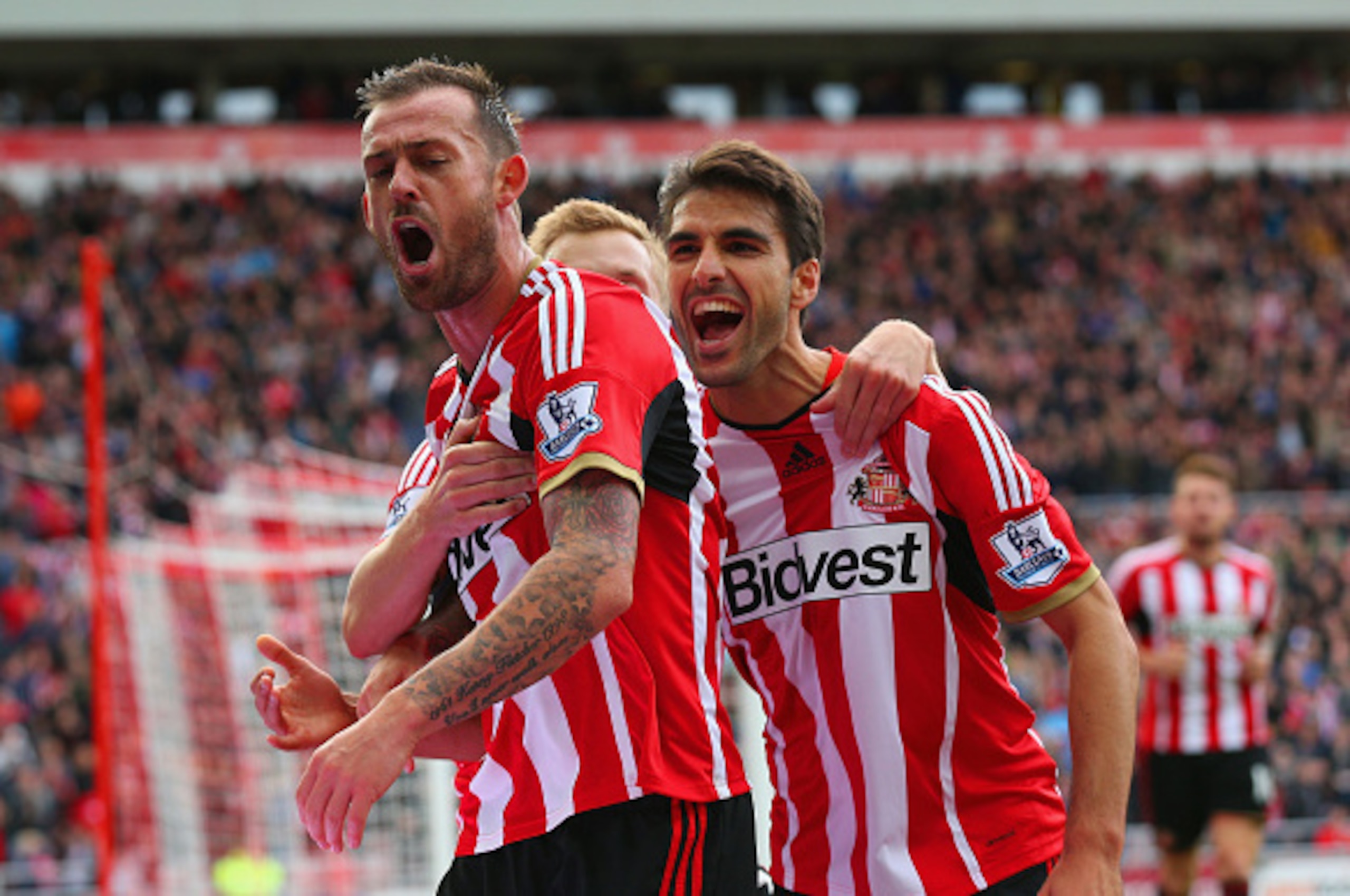 SUNDERLAND, ENGLAND - OCTOBER 04:  Steven Fletcher of Sunderland celebrates scoring the second goal with Jordi Gomez and Sebastian Larsson of Sunderland during the Barclays Premier League match between Sunderland and Stoke City at Stadium of Light on Octo