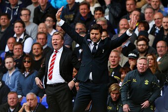 LONDON, ENGLAND - OCTOBER 05:  Manager Mauricio Pochettino of Spurs and Ronald Koeman manager of Southampton react on the touchline during the Barclays Premier League match between Tottenham Hotspur and Southampton at White Hart Lane on October 5, 2014 in