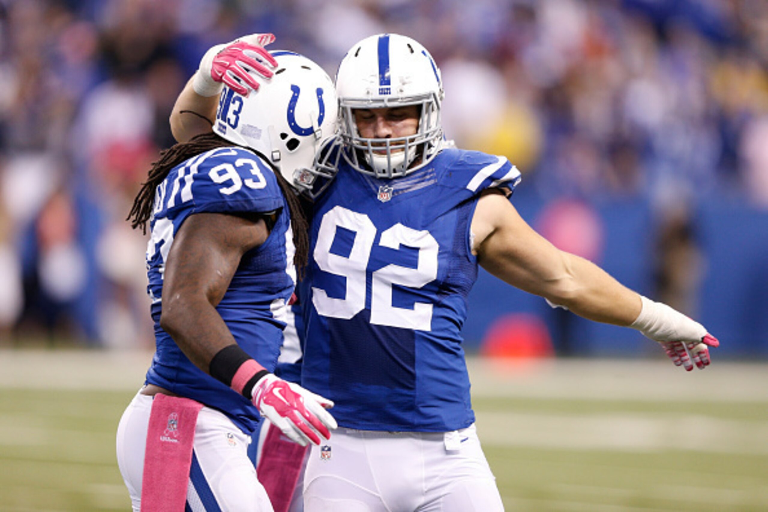 INDIANAPOLIS, IN - OCTOBER 5: Bjoern Werner #92 and Erik Walden #93 of the Indianapolis Colts celebrate in the closing seconds of the game against the Baltimore Ravens at Lucas Oil Stadium on October 5, 2014 in Indianapolis, Indiana. The Colts defeated th
