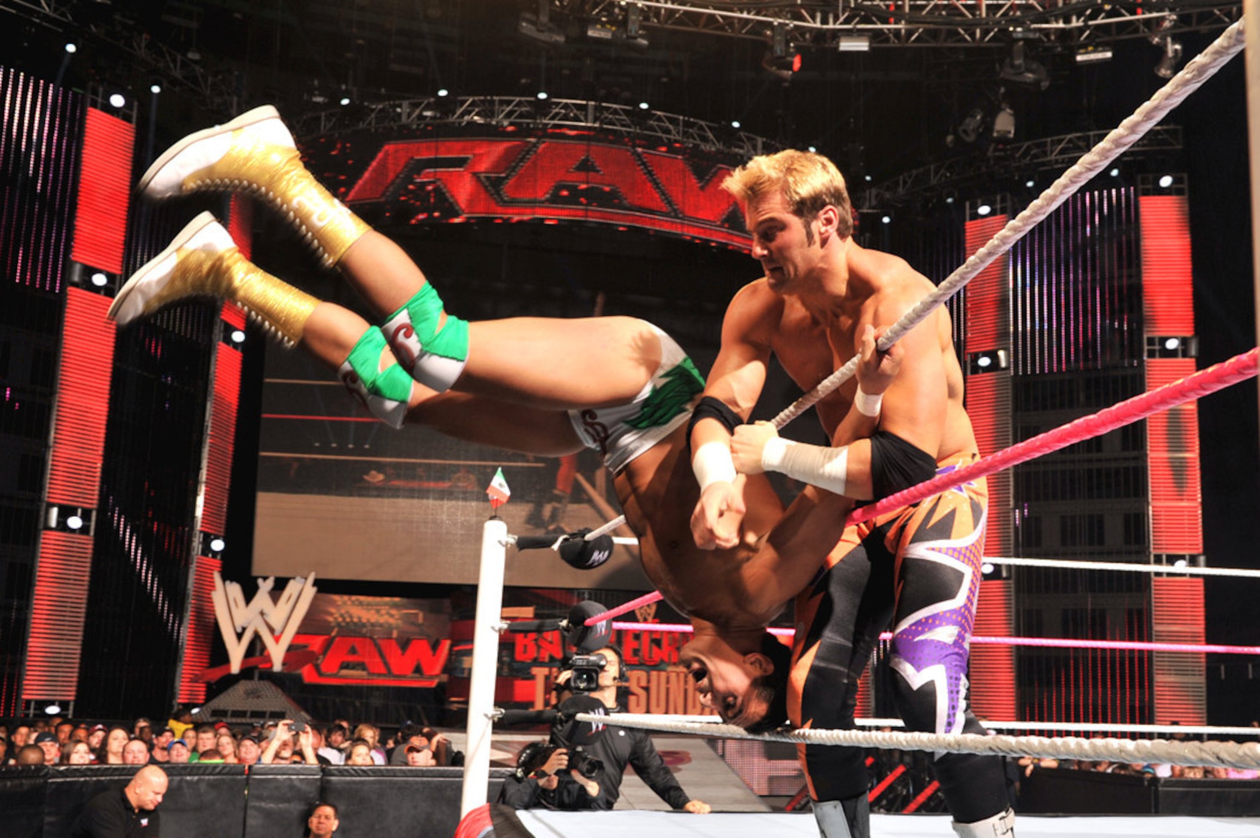Zack Ryder tosses Alberto Del Rio over the top rope.