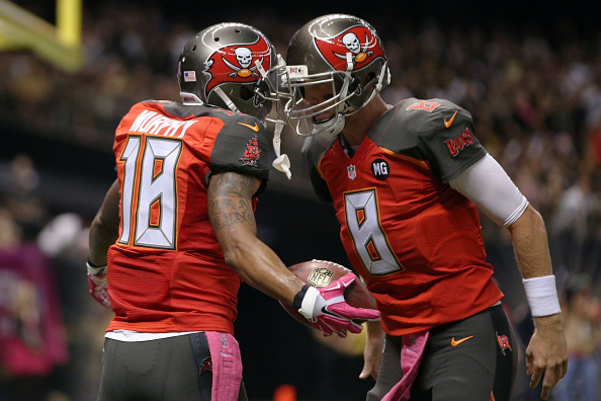 NEW ORLEANS, LA - OCTOBER 05:  Mike Glennon #8 celebrates a touchdown with Louis Murphy #18 of the Tampa Bay Buccaneers during the second quarter of a game against the New Orleans Saints at the Mercedes-Benz Superdome on October 5, 2014 in New Orleans, Lo