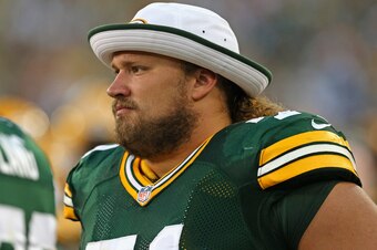 GREEN BAY, WI - AUGUST 09: Josh Sitton #71 of the Green Bay Packers watches from the sidelines as teammates take on the Arizona Cardinals at Lambeau Field on August 9, 2013 in Green Bay, Wisconsin. The Cardinals defeated the Packers 17-0. (Photo by Jonath