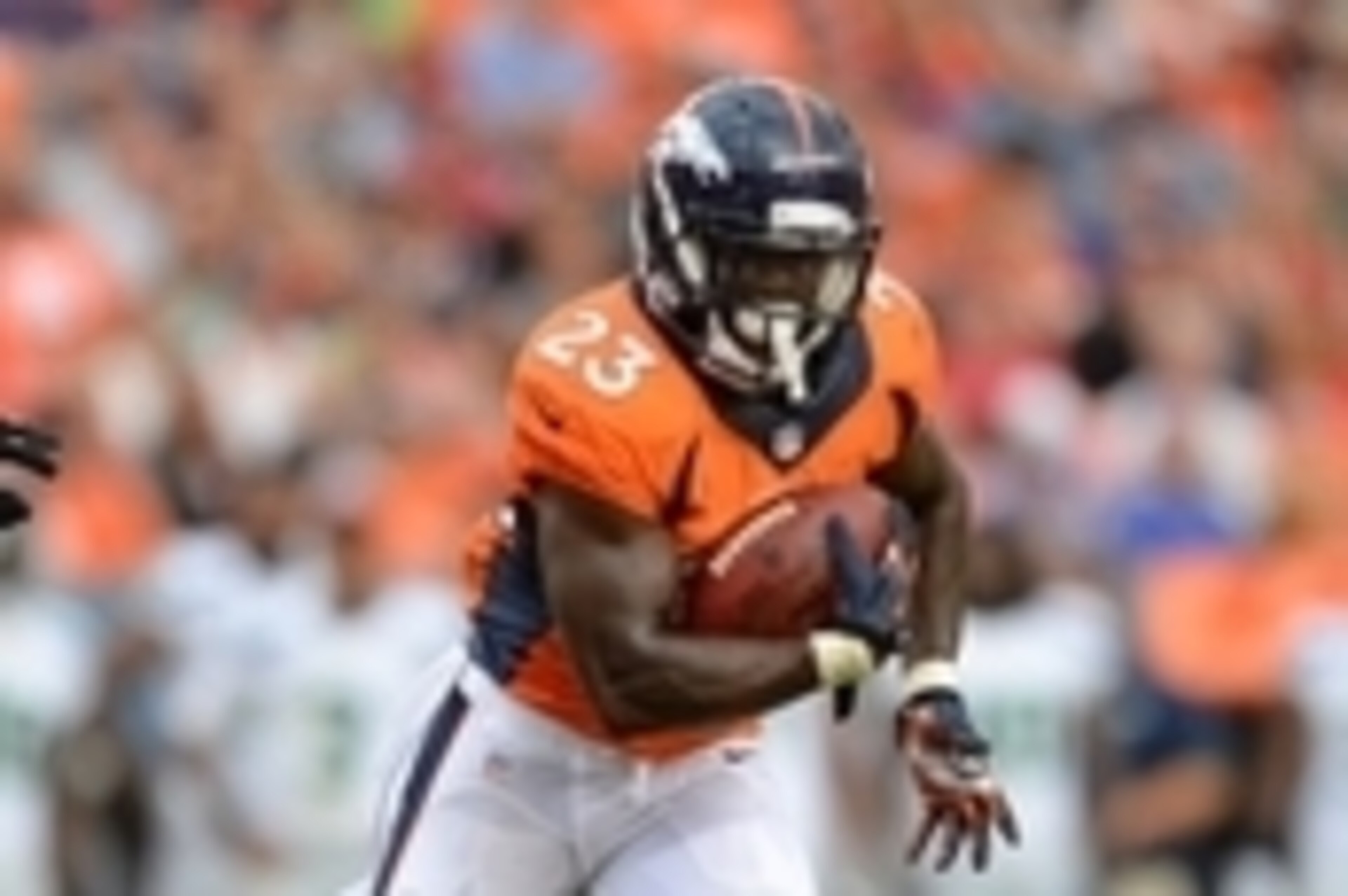 Aug 7, 2014; Denver, CO, USA; Denver Broncos running back Ronnie Hillman (23) runs in the first quarter of a preseason game against the Seattle Seahawks at Sports Authority Field at Mile High. Mandatory Credit: Ron Chenoy-USA TODAY Sports