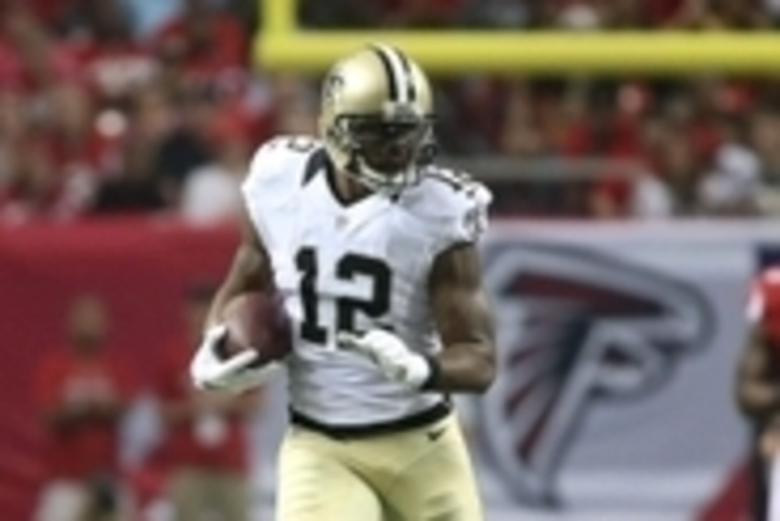 Sep 7, 2014; Atlanta, GA, USA; New Orleans Saints wide receiver Marques Colston (12) runs after a catch during their game against the Atlanta Falcons at the Georgia Dome. The Falcons won 37-34 in overtime. Mandatory Credit: Jason Getz-USA TODAY Sports