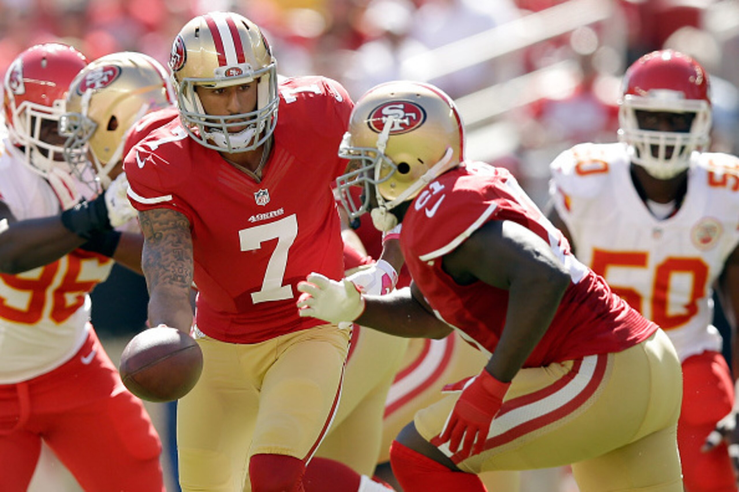 SANTA CLARA, CA - OCTOBER 05:  Colin Kaepernick #7 of the San Francisco 49ers hands off to Frank Gore #21 during their game against the Kansas City Chiefs at Levi's Stadium on October 5, 2014 in Santa Clara, California.  (Photo by Ezra Shaw/Getty Images)