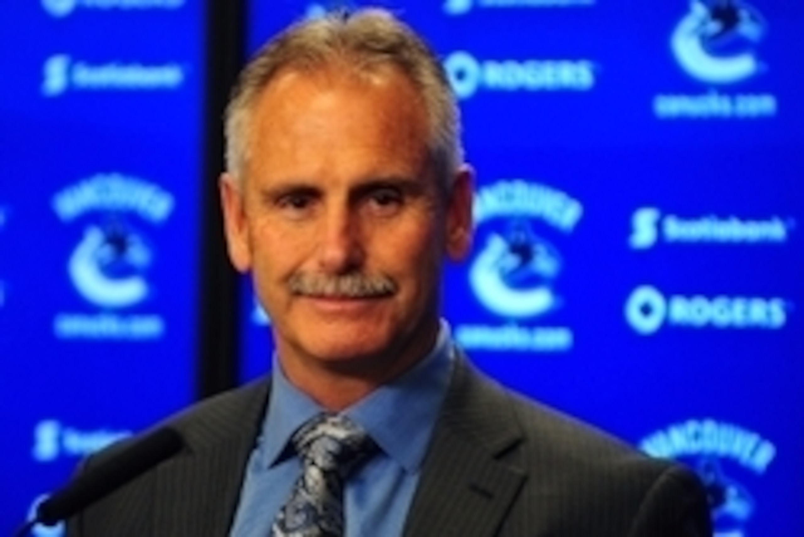 Sep 26, 2014; Vancouver, British Columbia, CAN; Vancouver Canucks head coach Willie Desjardins addresses the media after the third period at Rogers Arena. The Vancouver Canucks won 3-0. Mandatory Credit: Anne-Marie Sorvin-USA TODAY Sports