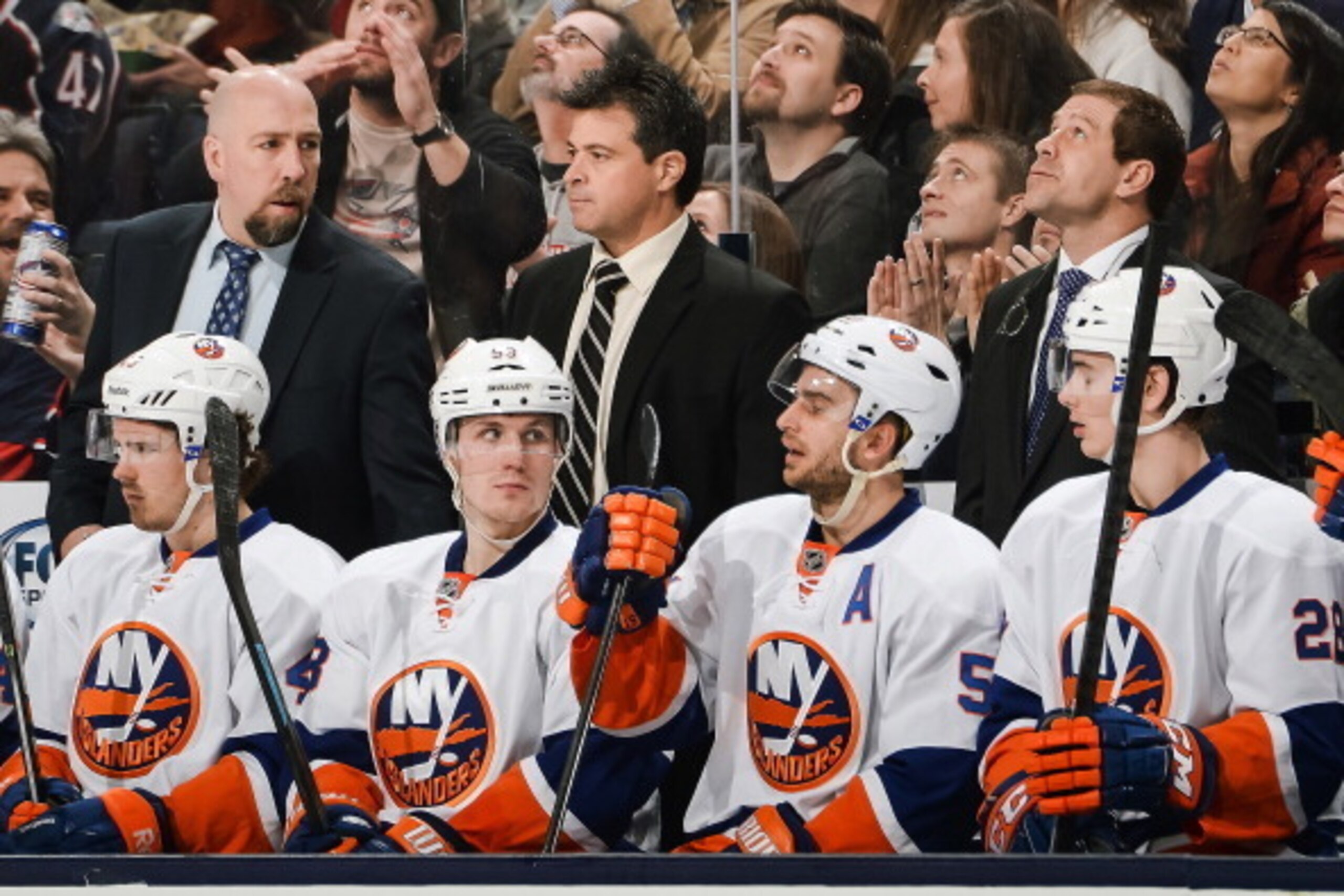 COLUMBUS, OH - APRIL 6:  Assistant Coach Brent Thompson, left, Head Coach Jack Capuano, center and Assistant Coach Doug Weight, right, all of the New York Islanders, watch their team play against the Columbus Blue Jackets on April 6, 2014 at Nationwide Ar