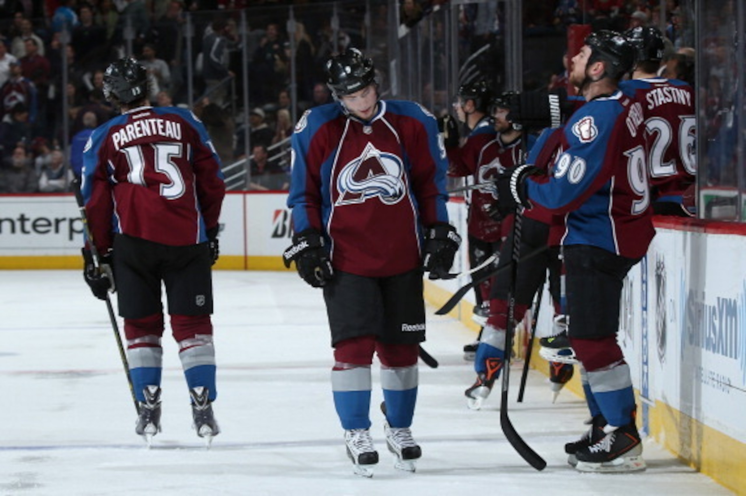 DENVER, CO - APRIL 30:  P.A. Parenteau #15, Matt Duchene #9 and Ryan O'Reilly #90 of the Colorado Avalanche skate off the ice after loosing to the Minnesota Wild in overtime of Game Seven of the First Round of the 2014 NHL Stanley Cup Playoffs at Pepsi Ce