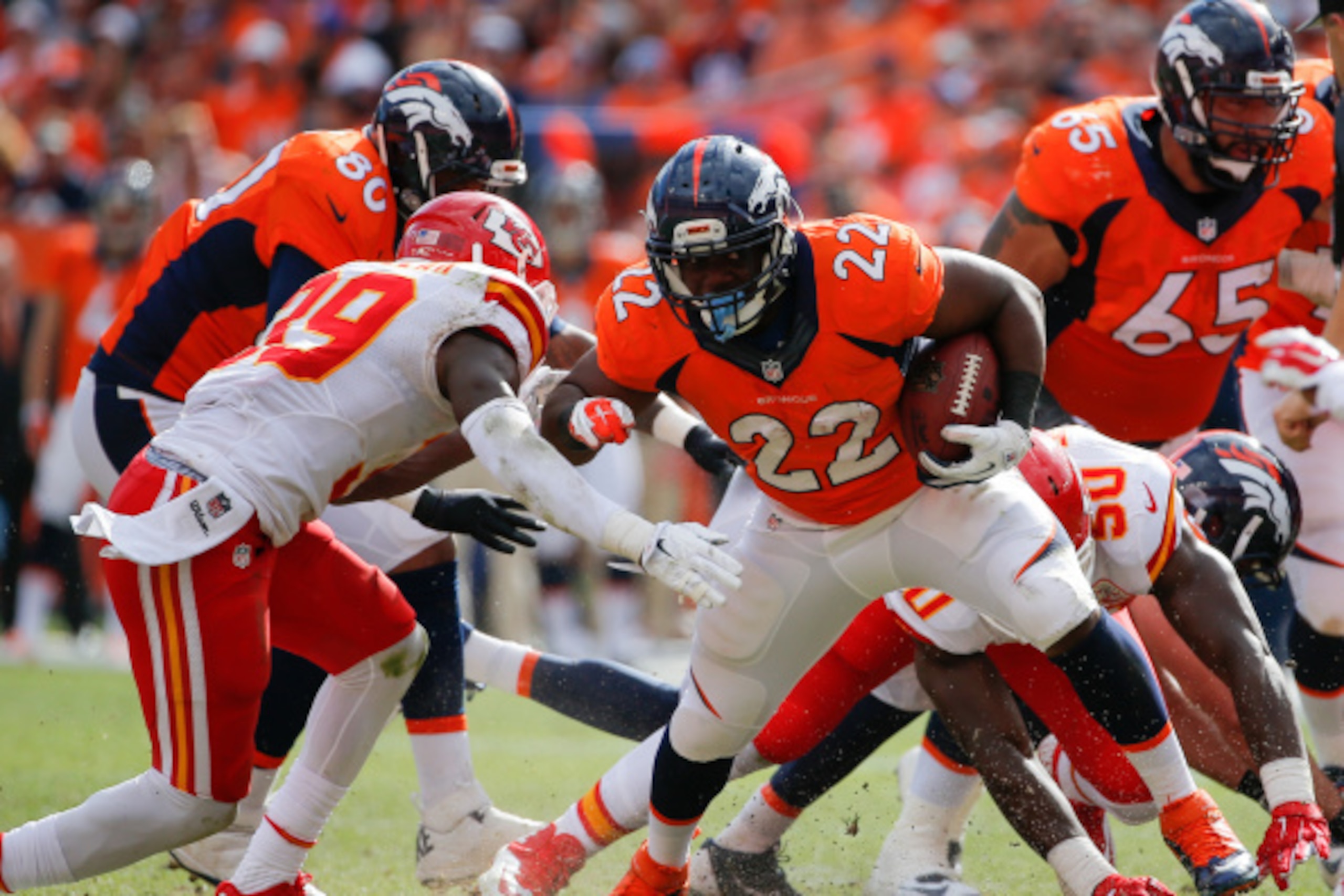 DENVER, CO - SEPTEMBER 14:  Running back C.J. Anderson #22 of the Denver Broncos rushes against the Kansas City Chiefs during a game at Sports Authority Field at Mile High on September 14, 2014 in Denver, Colorado.  (Photo by Doug Pensinger/Getty Images)
