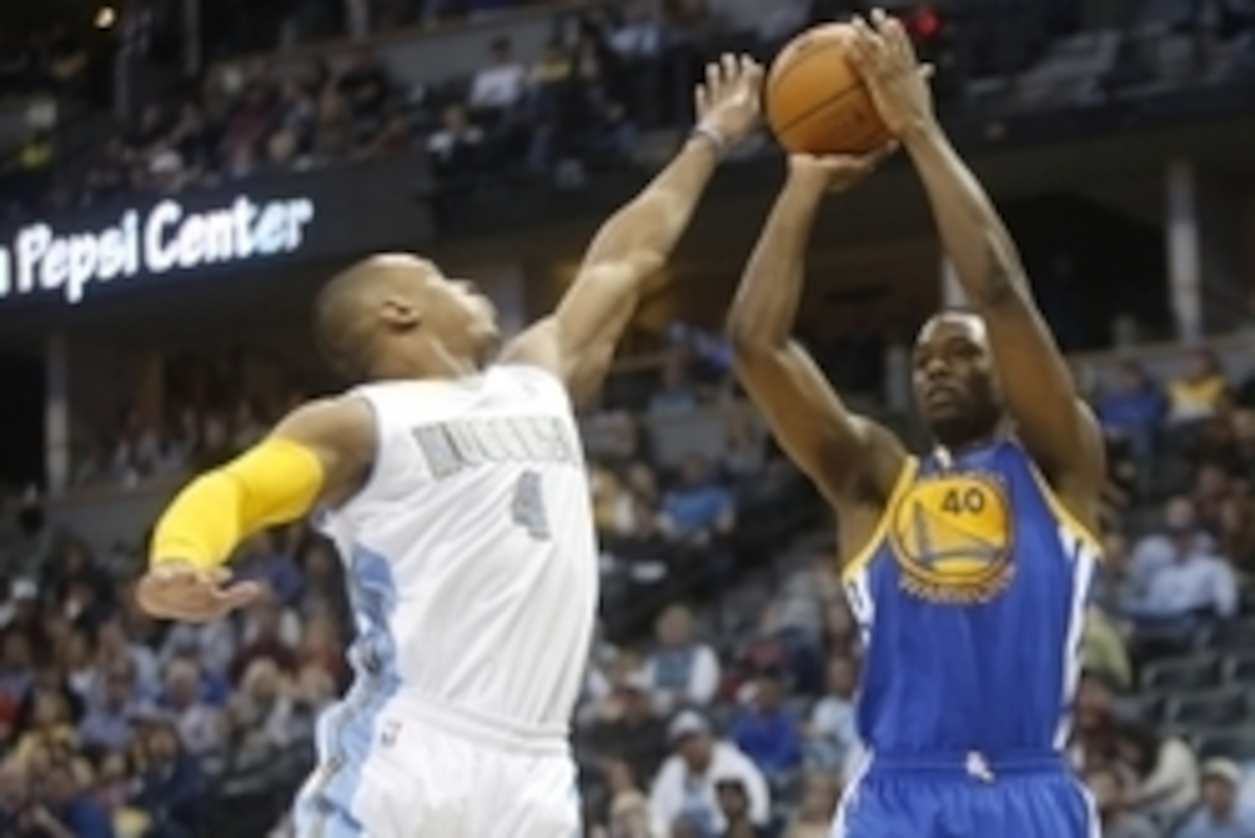 Apr 16, 2014; Denver, CO, USA; Golden State Warriors forward Harrison Barnes (40) shoots the ball over Denver Nuggets guard Randy Foye (4) during the second half at Pepsi Center.  The Warriors won 116-112.  Mandatory Credit: Chris Humphreys-USA TODAY Spor