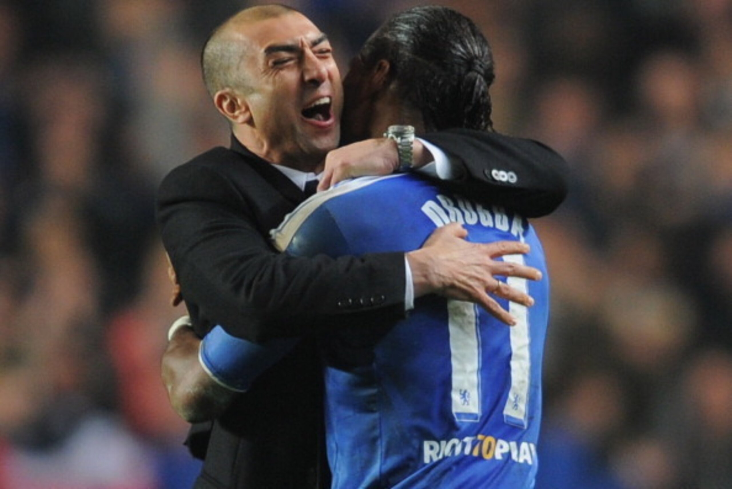 LONDON, ENGLAND - MARCH 14: Roberto Di Matteo caretaker manager of Chelsea celebrates victory with Didier Drogba after the UEFA Champions League Round of 16 second leg match between Chelsea FC and SSC Napoli at Stamford Bridge on March 14, 2012 in London LONDON, ENGLAND - MARCH 14: Roberto Di Matteo caretaker manager of Chelsea celebrates victory with Didier Drogba after the UEFA Champions League Round of 16 second leg match between Chelsea FC and SSC Napoli at Stamford Bridge on March 14, 2012 in London