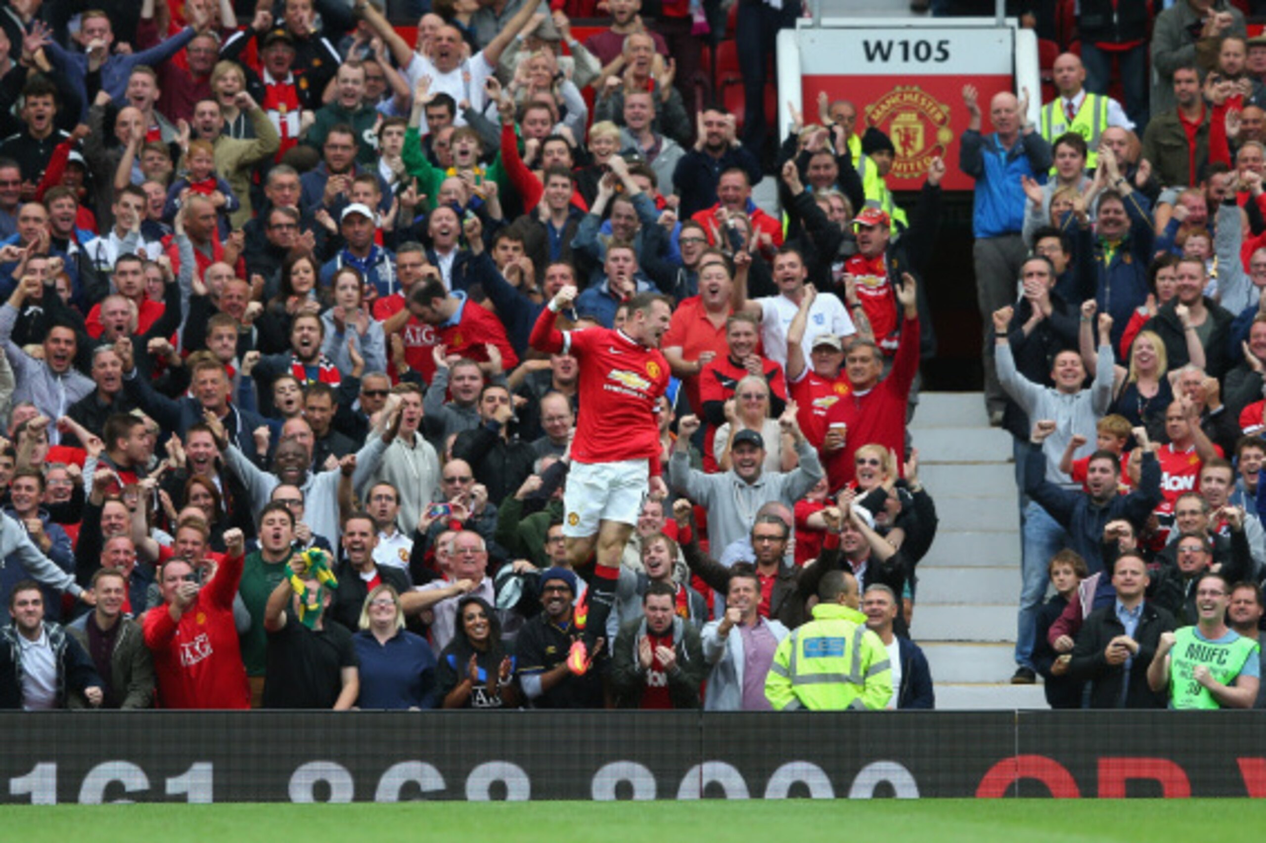 MANCHESTER, ENGLAND - AUGUST 16:  Wayne Rooney of Manchester United celebrates scoring his team's first goal during the Barclays Premier League match between Manchester United and Swansea City at Old Trafford on August 16, 2014 in Manchester, England.  (P
