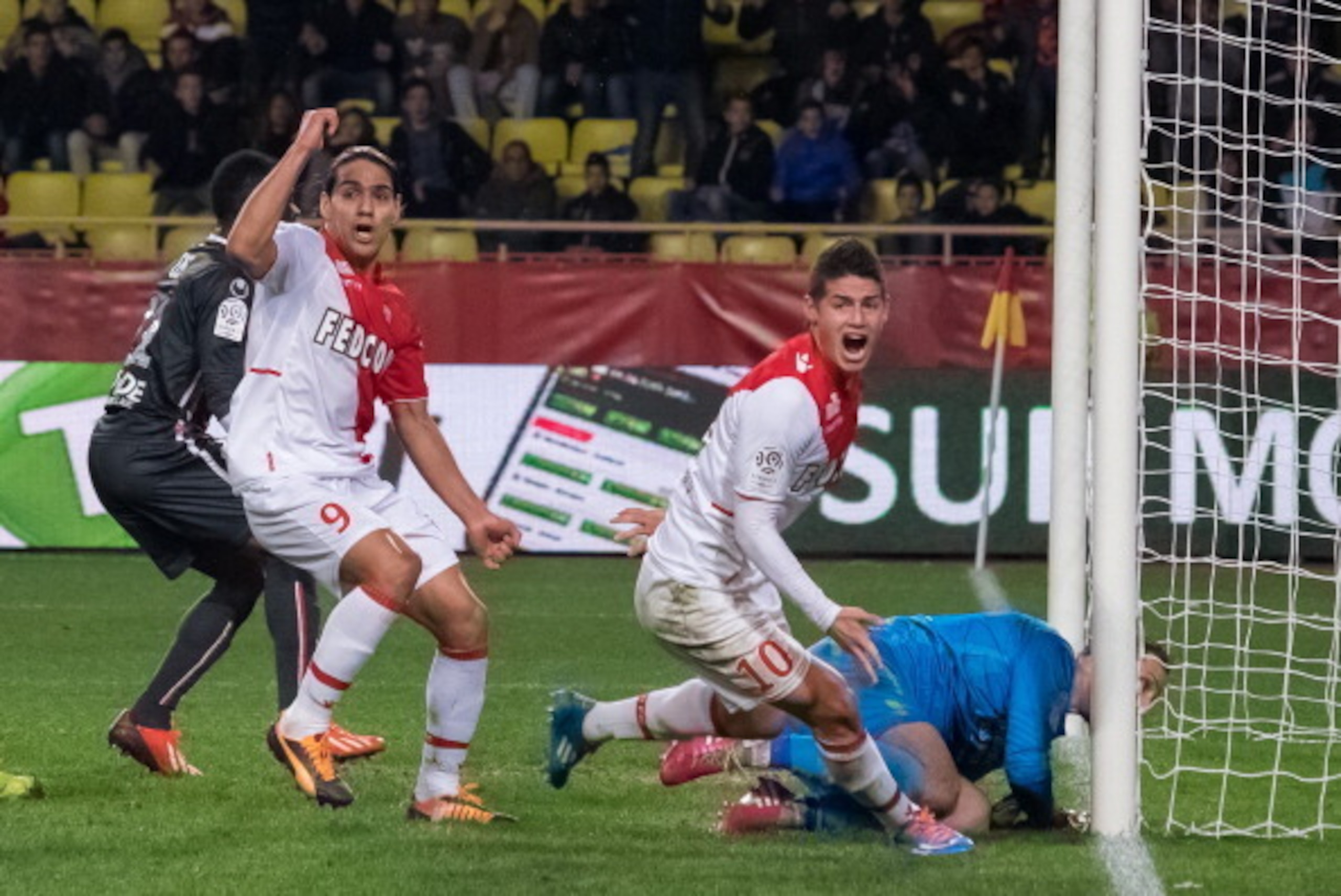 MONTE-CARLO, MONACO - DECEMBER 20:  Monaco's foward James Rodriguez  (R) goals with Radamel Falcao (L)  during the French L1 football match between AS Monaco vs Valenciennes at Louis II Stadium on December 20, 2013 in Monte-Carlo, Monaco.  (Photo by Didie