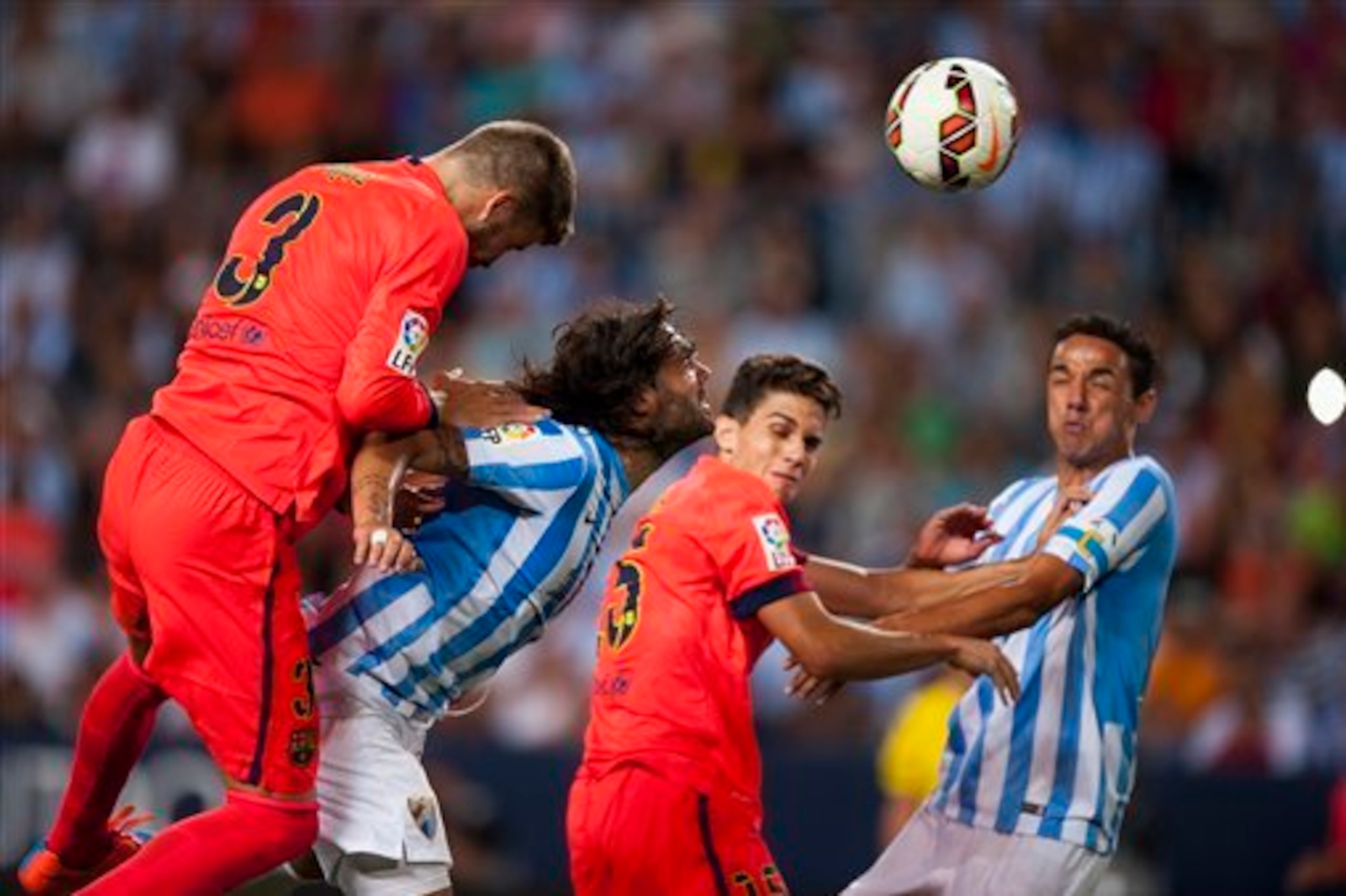 Pique and Bartra in action for Barca.