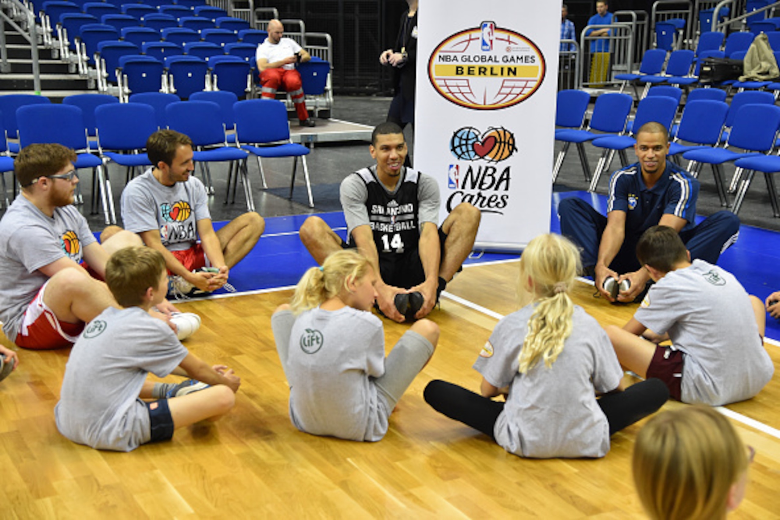 BERLIN - OCTOBER 7: Danny Green #14 of the San Antonio Spurs stretches during an NBA Cares Special Olympics Clinic as part of the 2014 Global Games on October 7, 2014 at the O2 Arena in Berlin, Germany. NOTE TO USER: User expressly acknowledges and agrees