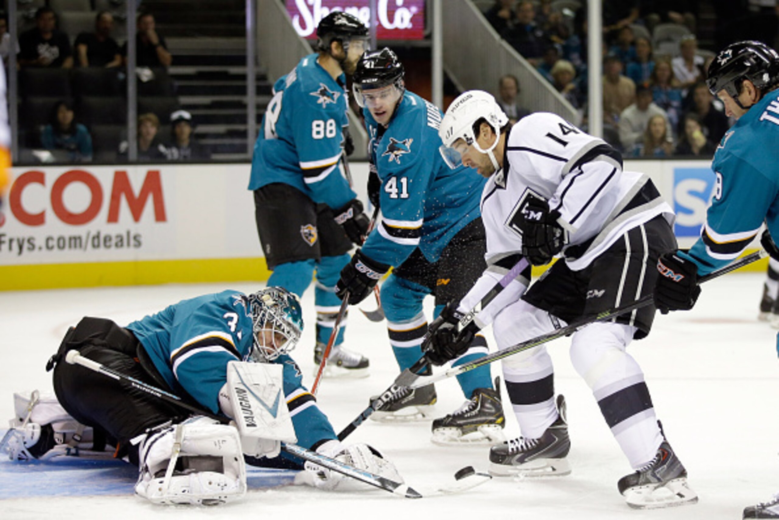 SAN JOSE, CA - SEPTEMBER 30:  Antti Niemi #31 of the San Jose Sharks stops Justin Williams #14 of the Los Angeles Kings from scoring during their preseason game at SAP Center on September 30, 2014 in San Jose, California.  (Photo by Ezra Shaw/Getty Images