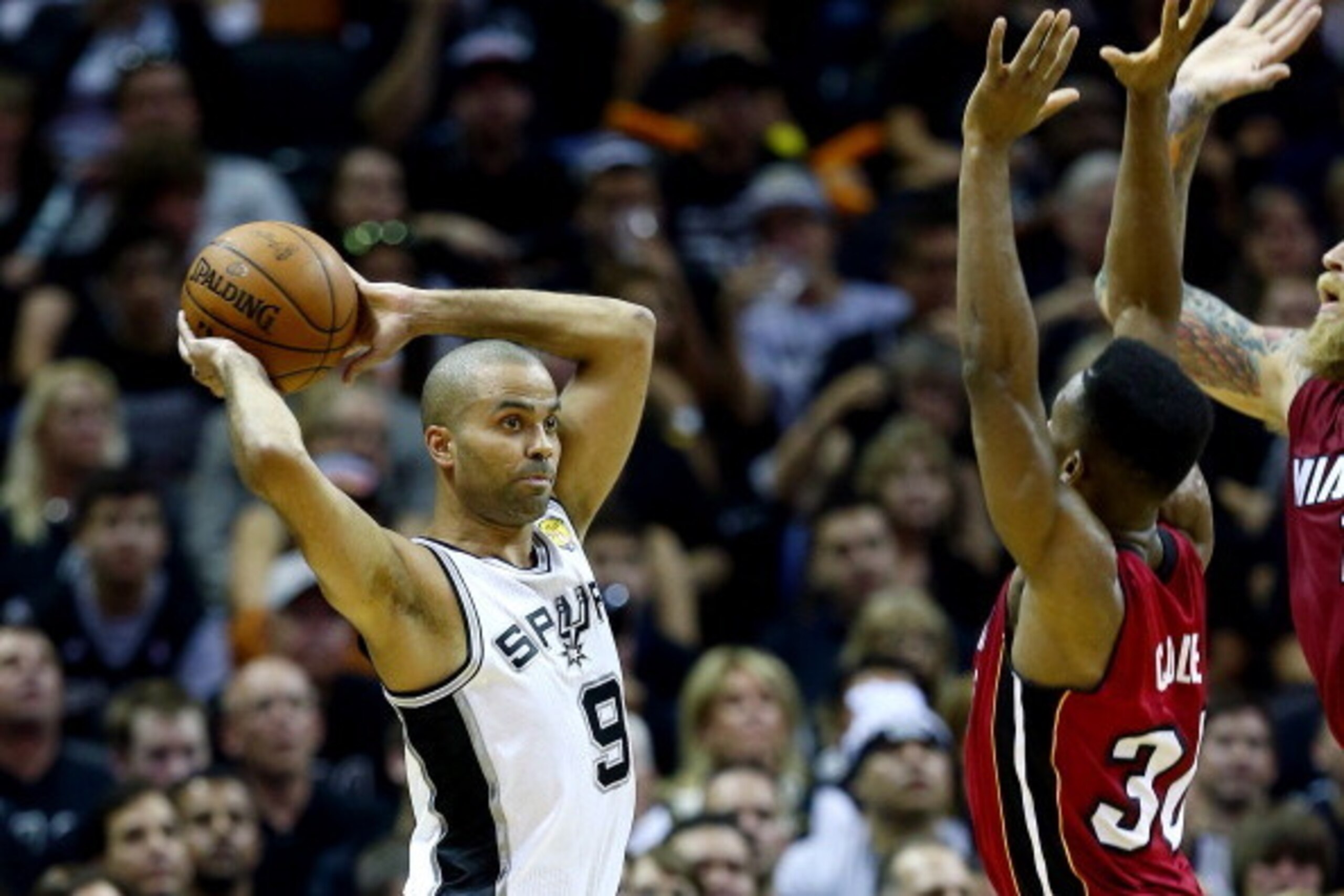 SAN ANTONIO, TX - JUNE 05:  Tony Parker #9 of the San Antonio Spurs looks to pass as s30 defends during Game One of the 2014 NBA Finals at the AT&T Center on June 5, 2014 in San Antonio, Texas. NOTE TO USER: User expressly acknowledges and agrees that, by