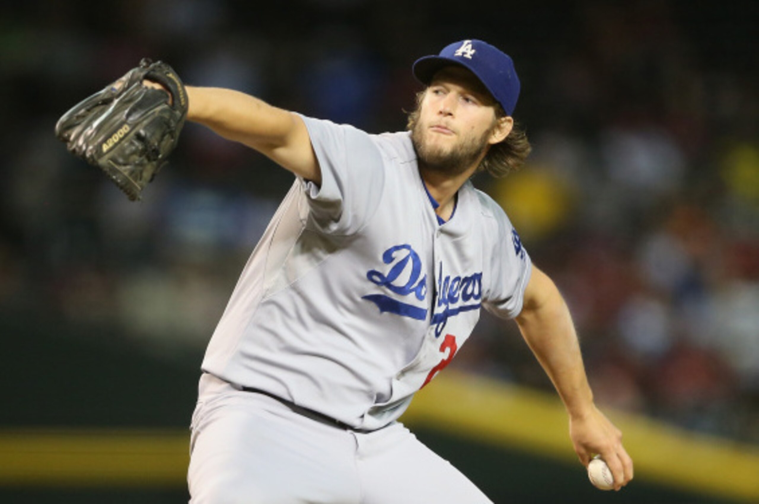 PHOENIX, AZ - AUGUST 27:  Starting pitcher Clayton Kershaw #22 of the Los Angeles Dodgers pitches against the Arizona Diamondbacks during the MLB game at Chase Field on August 27, 2014 in Phoenix, Arizona.  The Dodgers defeated the Diamondbacks 3-1.  (Pho