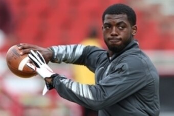 Oct 4, 2014; College Park, MD, USA; Ohio State Buckeyes quarterback J.T. Barrett (16) throws the ball prior to the game against the Maryland Terrapins at Byrd Stadium. Mandatory Credit: Mitch Stringer-USA TODAY Sports