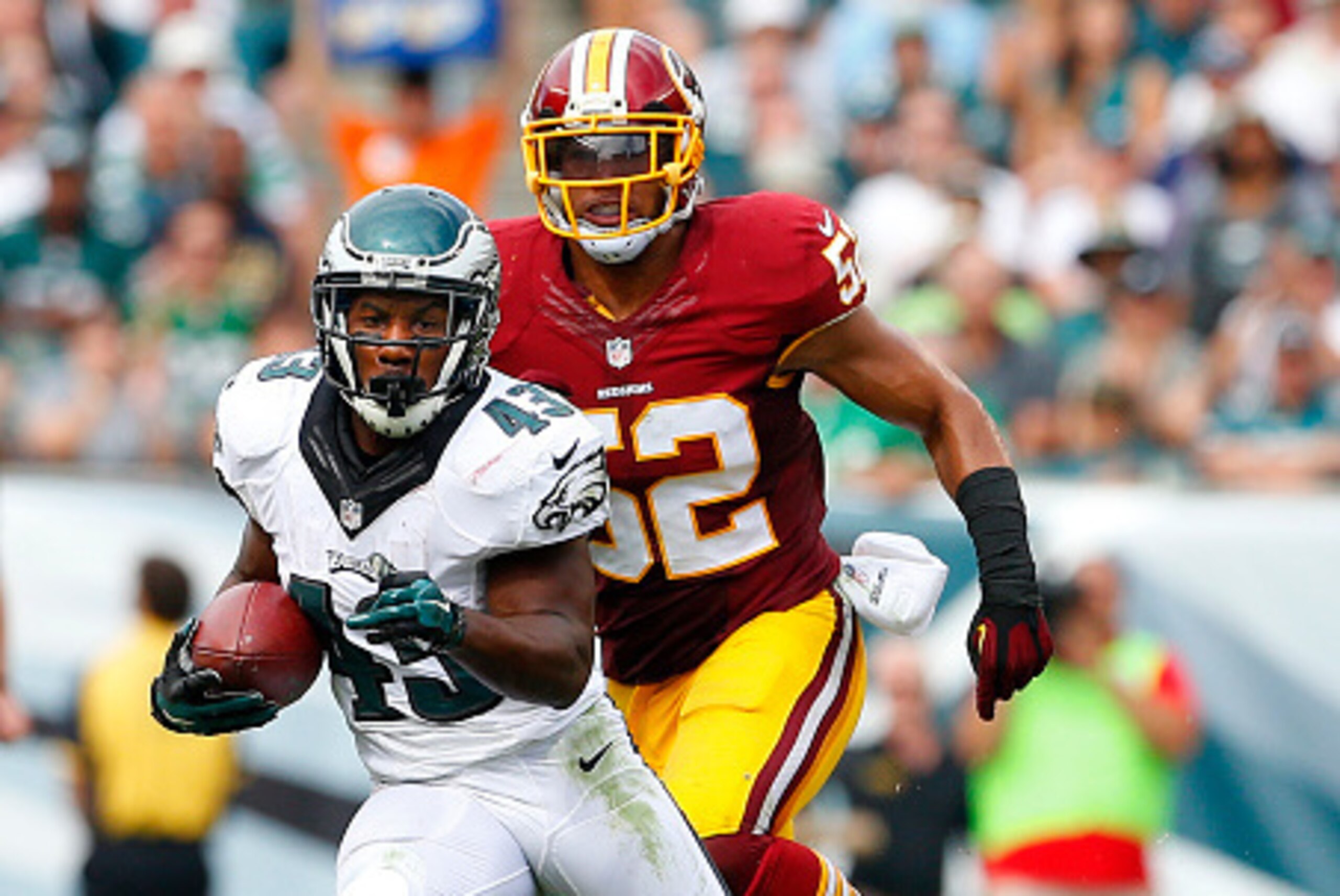 PHILADELPHIA, PA - SEPTEMBER 21:  Darren Sproles #43 of the Philadelphia Eagles runs after making a catch in front of Keenan Robinson #52 of the Washington Redskins in the third quarter at Lincoln Financial Field on September 21, 2014 in Philadelphia, Pen