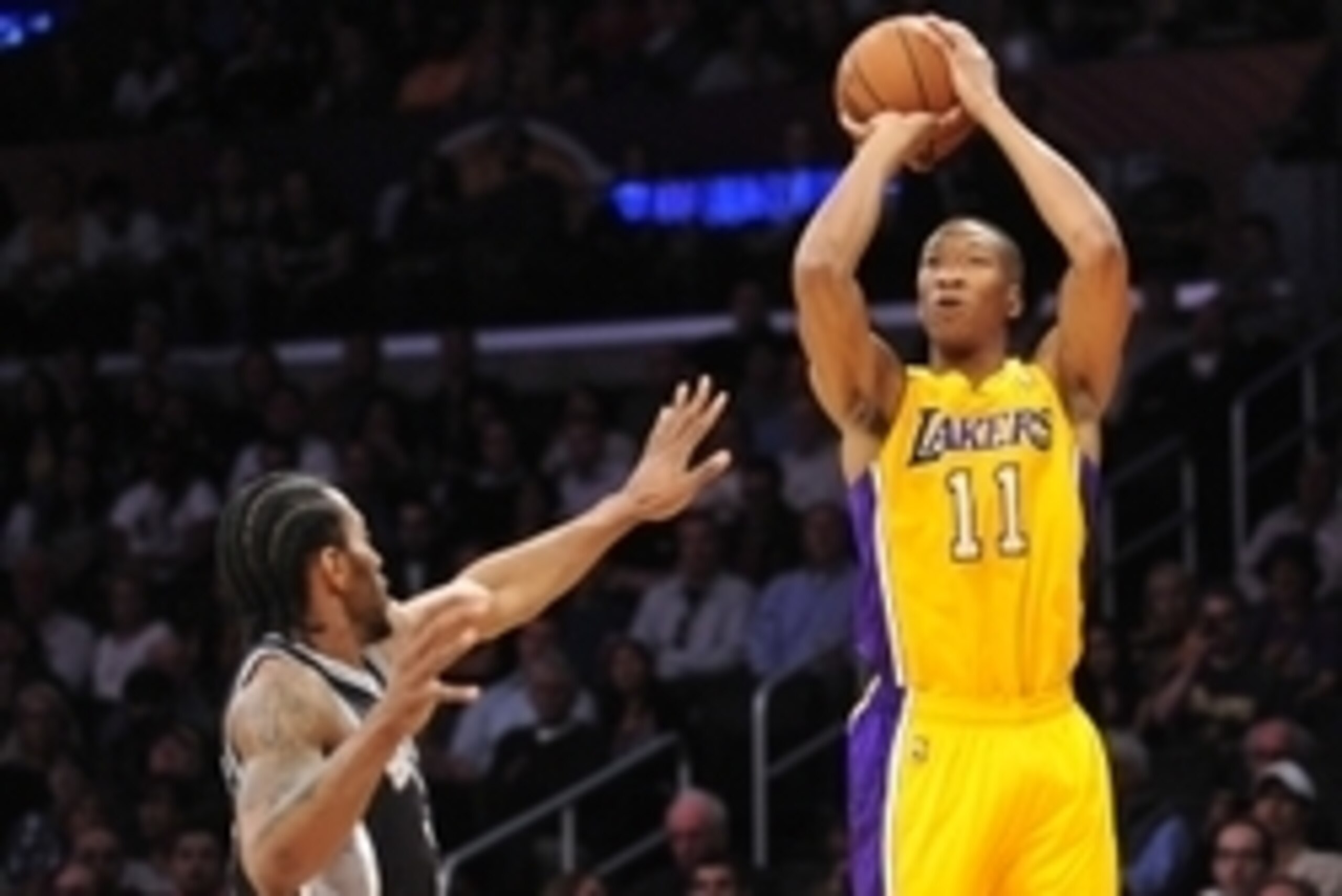 March 19, 2014; Los Angeles, CA, USA; Los Angeles Lakers forward Wesley Johnson (11) shoots a basket against the San Antonio Spurs during the first half at Staples Center. Mandatory Credit: Gary A. Vasquez-USA TODAY Sports
