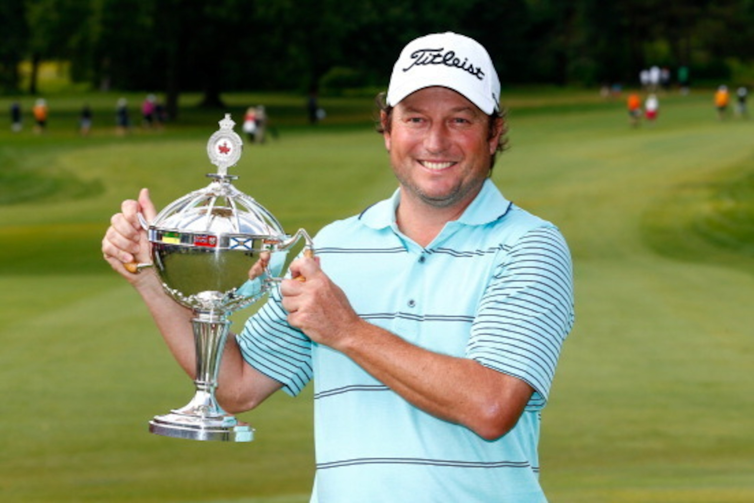 MONTREAL, QC - JULY 27: Tim Clark of South Africa holds the trophy after winning the RBC Canadian Open at the Royal Montreal Golf Club on July 27, 2014 in Montreal, Quebec, Canada. (Photo by Sam Greenwood/Getty Images) MONTREAL, QC - JULY 27: Tim Clark of South Africa holds the trophy after winning the RBC Canadian Open at the Royal Montreal Golf Club on July 27, 2014 in Montreal, Quebec, Canada. (Photo by Sam Greenwood/Getty Images)