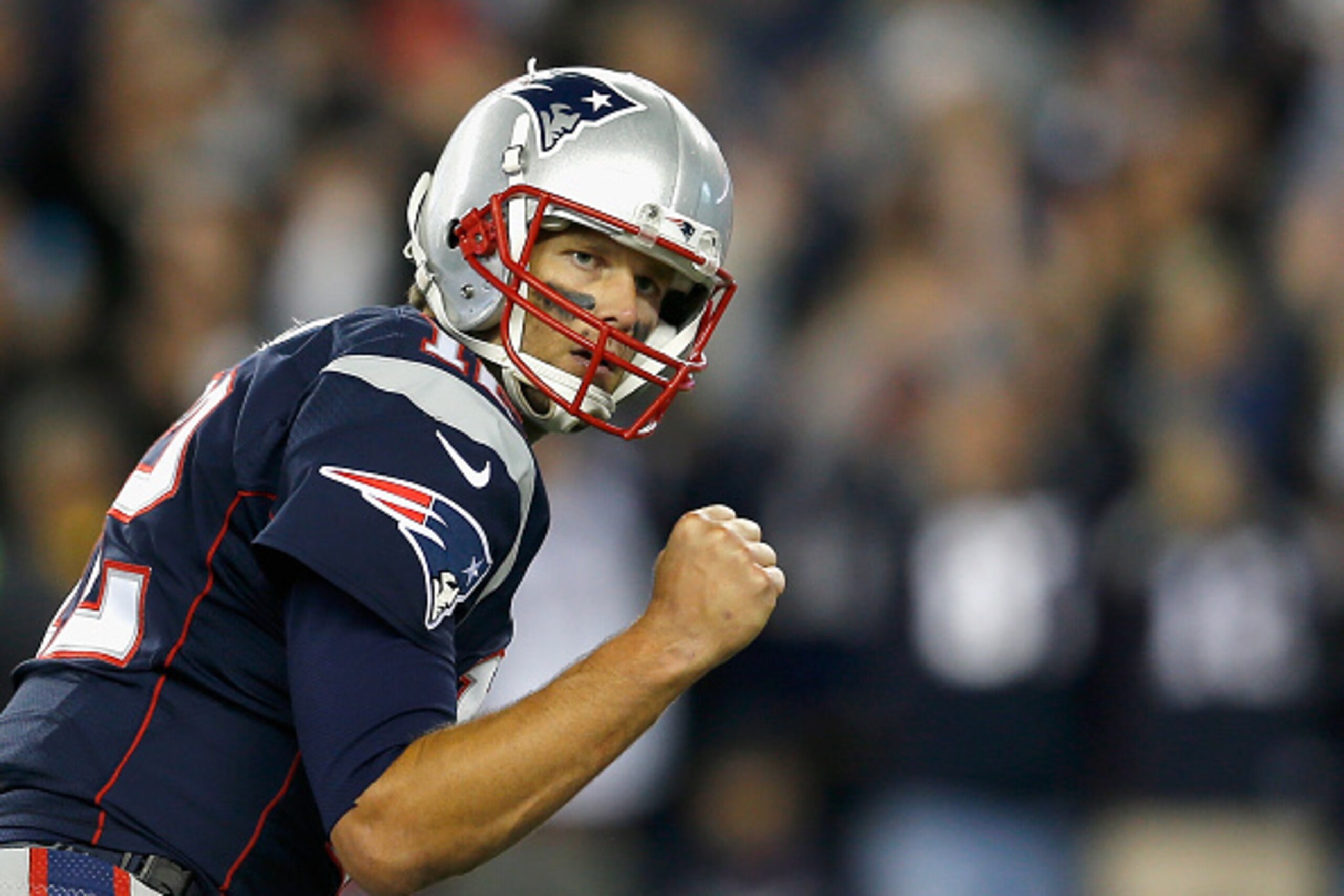 FOXBORO, MA - OCTOBER 05:  Tom Brady #12 of the New England Patriots reacts after throwing a touchdown pass during the third quarter against the Cincinnati Bengals at Gillette Stadium on October 5, 2014 in Foxboro, Massachusetts.  (Photo by Jim Rogash/Get