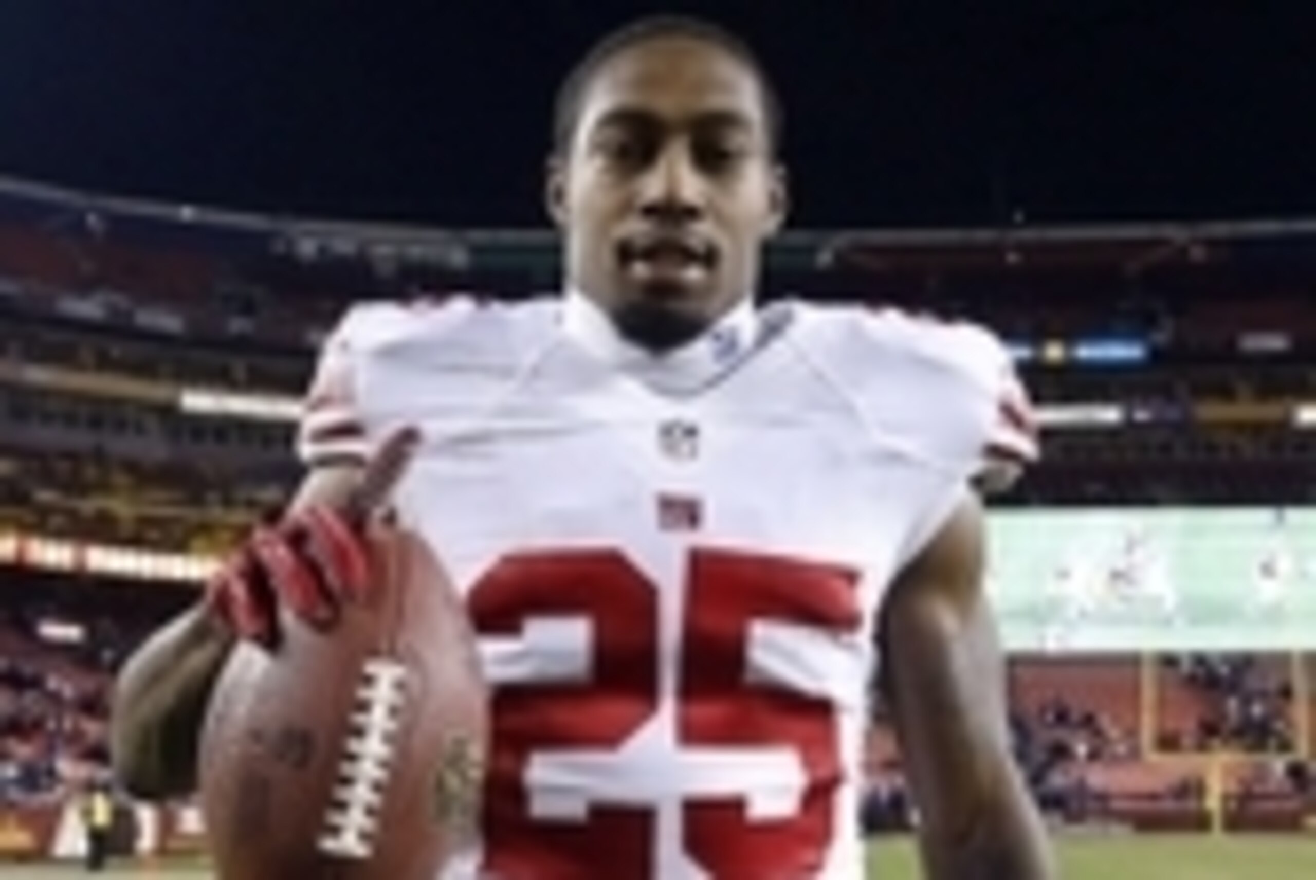 Dec 1, 2013; Landover, MD, USA;  New York Giants free safety Will Hill (25) holds the ball while leaving the field after the Giants game against the Washington Redskins at FedEx Field. The Giants won 24-17. Mandatory Credit: Geoff Burke-USA TODAY Sports