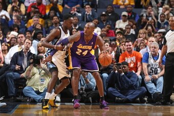 MEMPHIS, TN - DECEMBER 17: Kobe Bryant #24 of the Los Angeles Lakers controls the ball against the Memphis Grizzlies on December 17, 2013 at FedExForum in Memphis, Tennessee. NOTE TO USER: User expressly acknowledges and agrees that, by downloading and or