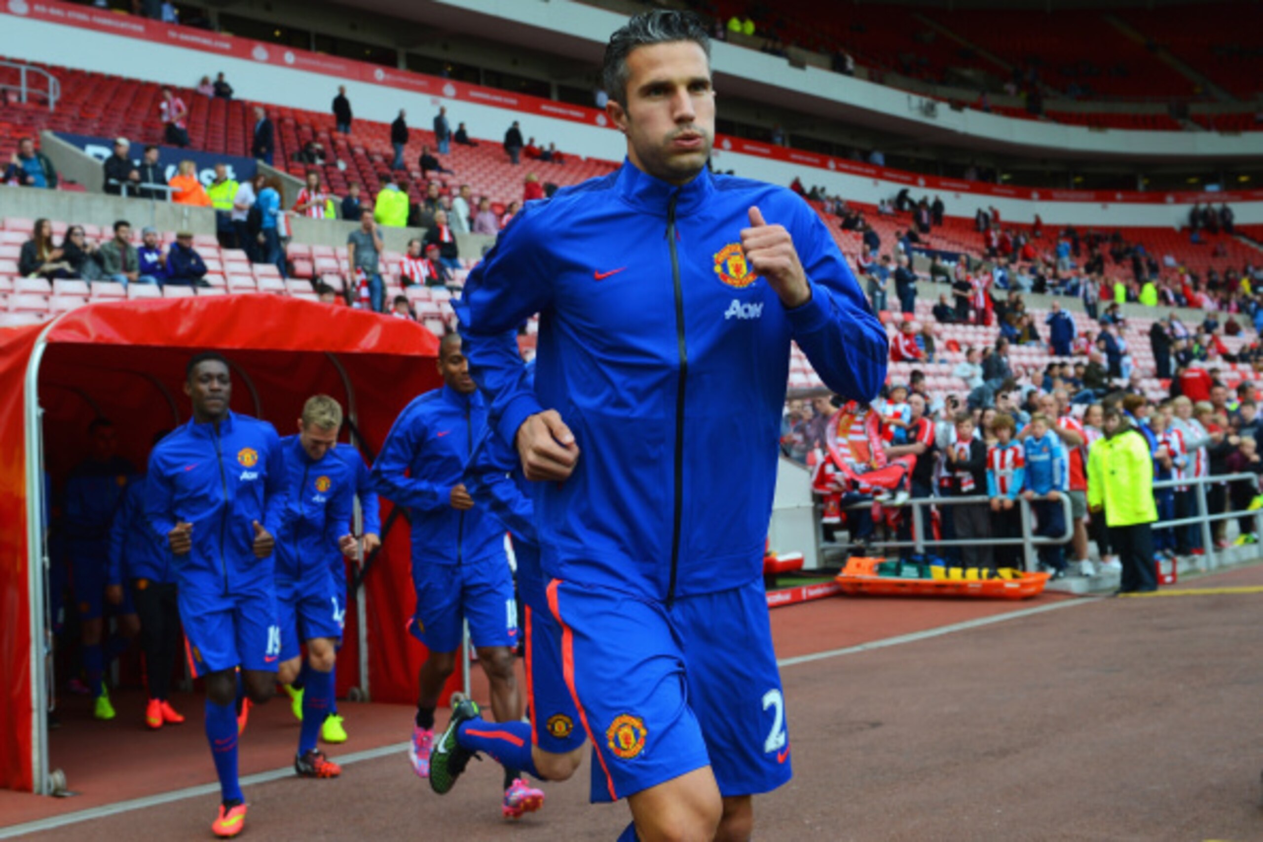 SUNDERLAND, ENGLAND - AUGUST 24:  Robin van Persie of Manchester United walks out for the warm up prior to the Barclays Premier League match between Sunderland and Manchester United at Stadium of Light on August 24, 2014 in Sunderland, England.  (Photo by