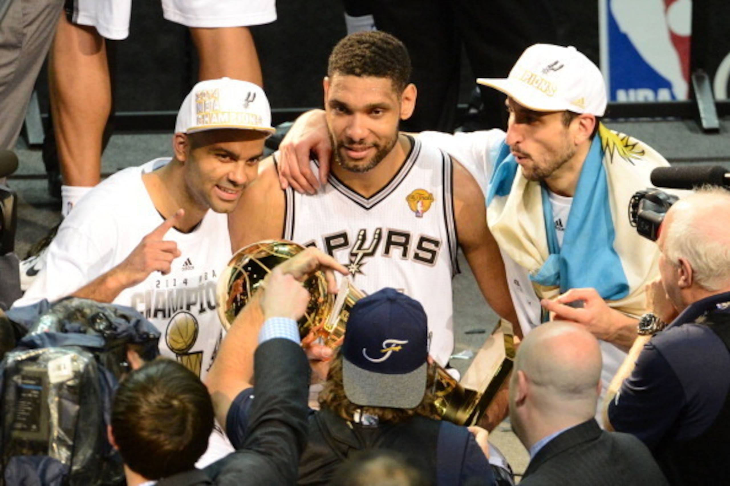 SAN ANTONIO, TX - JUNE 15: Tony Parker #9 ,  Tim Duncan #21 and Manu Ginobili #20 of the San Antonio Spurs pose for a picture against the Miami Heat during Game Five of the 2014 NBA Finals between the Miami Heat and San Antonio Spurs at AT&T Center on Jun