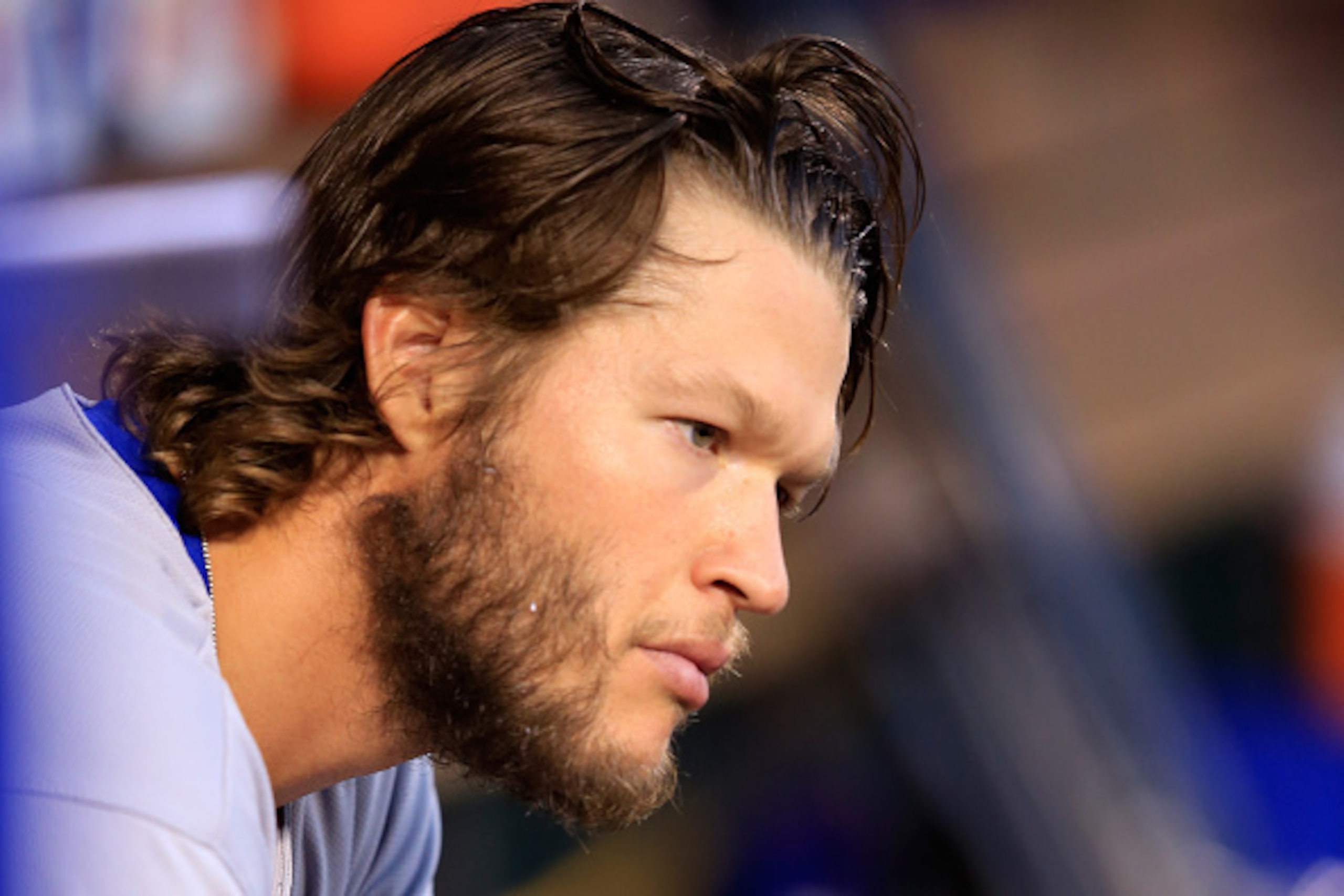 ST LOUIS, MO - OCTOBER 07:  Clayton Kershaw #22 of the Los Angeles Dodgers looks on from the dugout after allowing a three run home run in the seventh inning and exiting the game against the St. Louis Cardinals in Game Four of the National League Divison 