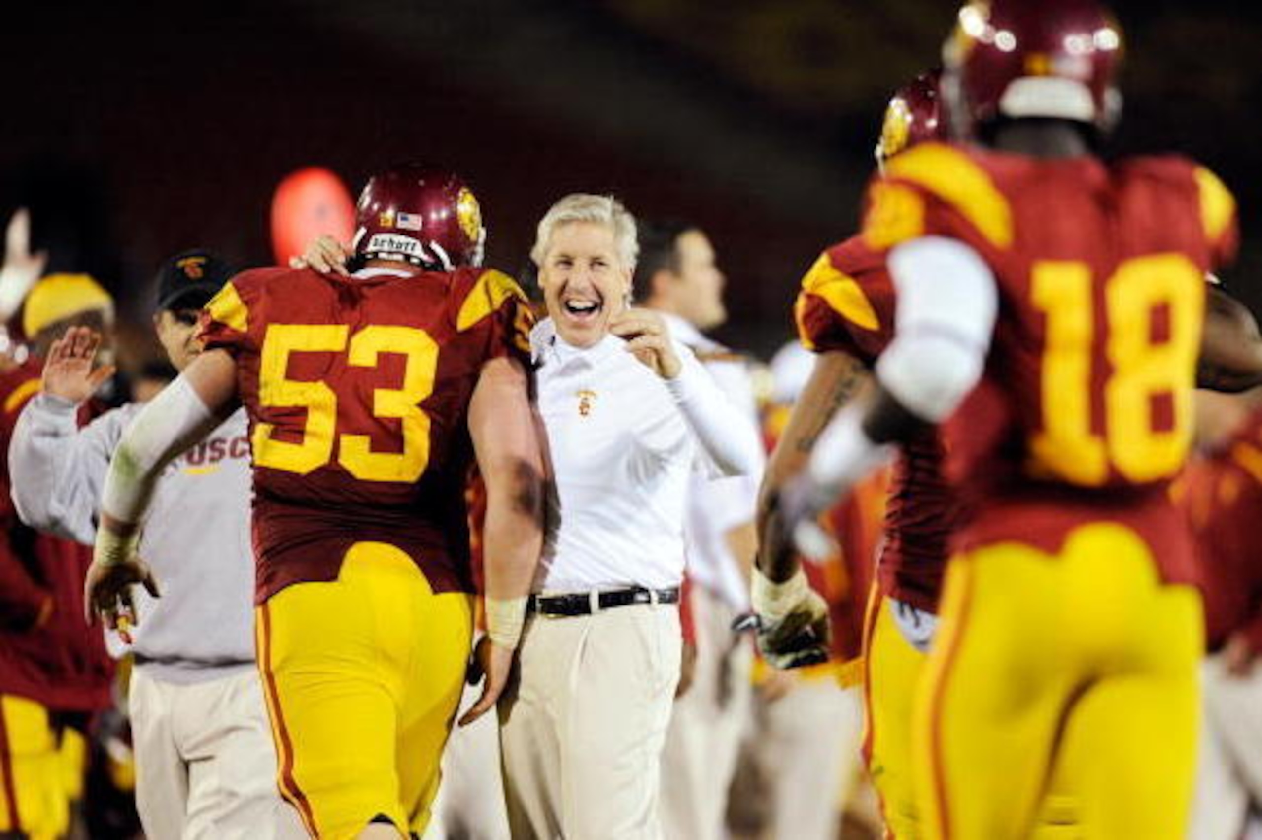 LOS ANGELES, CA - NOVEMBER 28:  Pete Carroll (C) of the USC Trojans celebrates with Jeff Byers #53 after Damian Williams #18 wide receiver of the USC Trojans scored a 48-yard touchdown pass after UCLA Bruins called a time out with one minute remaining in 