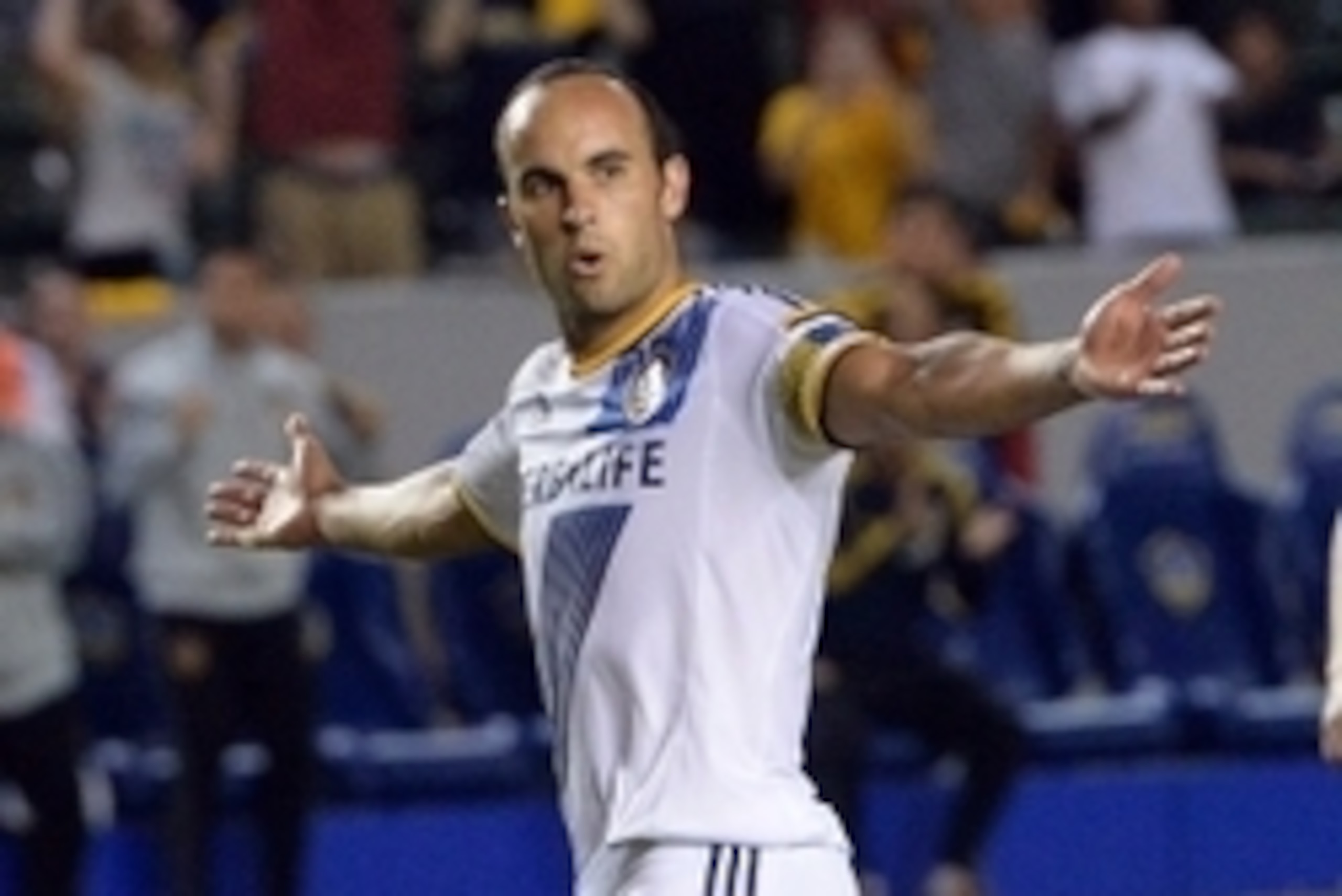 Aug 27, 2014; Carson, CA, USA; D.C. Los Angeles Galaxy midfielder Landon Donovan (10) raises his arms after scoring on a penalty kick in the second half of the game against D.C. United at StubHub Center. Galaxy won 4-1. Mandatory Credit: Jayne Kamin-Oncea