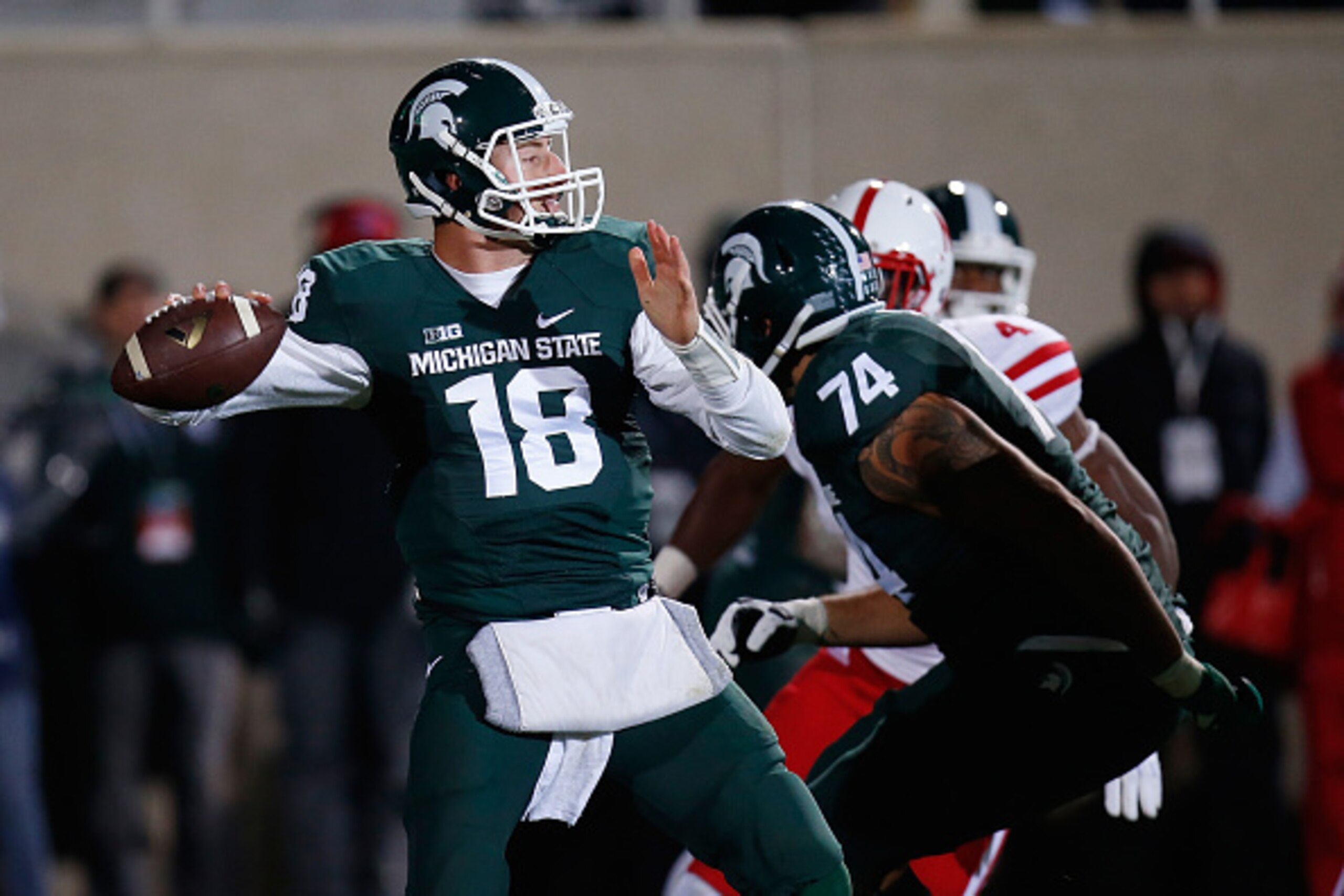 EAST LANSING, MI - OCTOBER 04: Connor Cook #18 of the Michigan State Spartans throws a first quarter pass while playing the Nebraska Cornhuskers at Spartan Stadium on October 4, 2014 in East Lansing, Michigan. (Photo by Gregory Shamus/Getty Images)