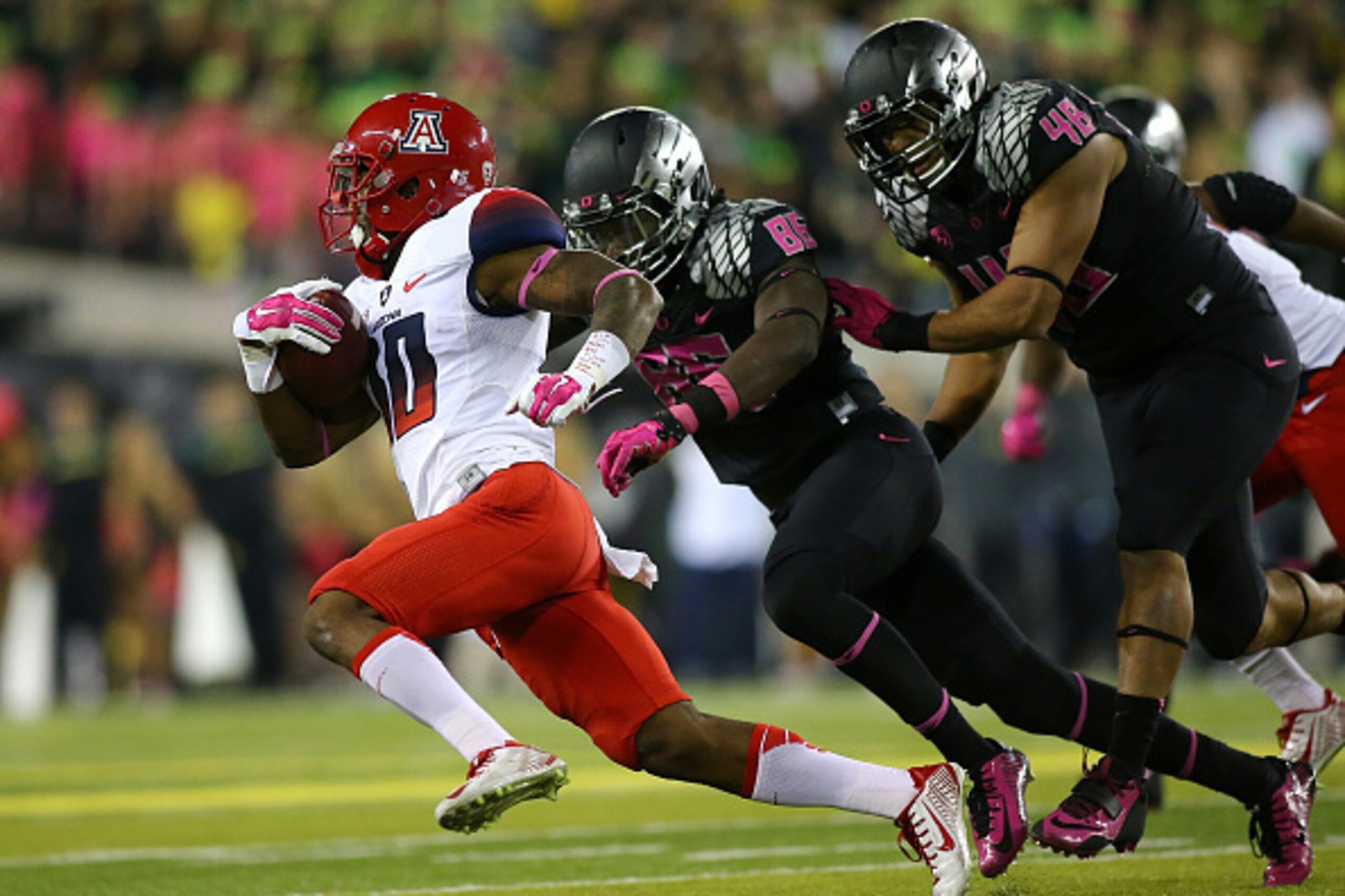 EUGENE, OR - OCTOBER 02: Samajie Grant #10 of the Arizona Wildcats out runs Torrodney Prevot #86 and Rodney Hardick #48 of the Oregon Ducks at Autzen Stadium on October 2, 2014 in Eugene, Oregon. (Photo by Jonathan Ferrey/Getty Images) EUGENE, OR - OCTOBER 02: Samajie Grant #10 of the Arizona Wildcats out runs Torrodney Prevot #86 and Rodney Hardick #48 of the Oregon Ducks at Autzen Stadium on October 2, 2014 in Eugene, Oregon. (Photo by Jonathan Ferrey/Getty Images)