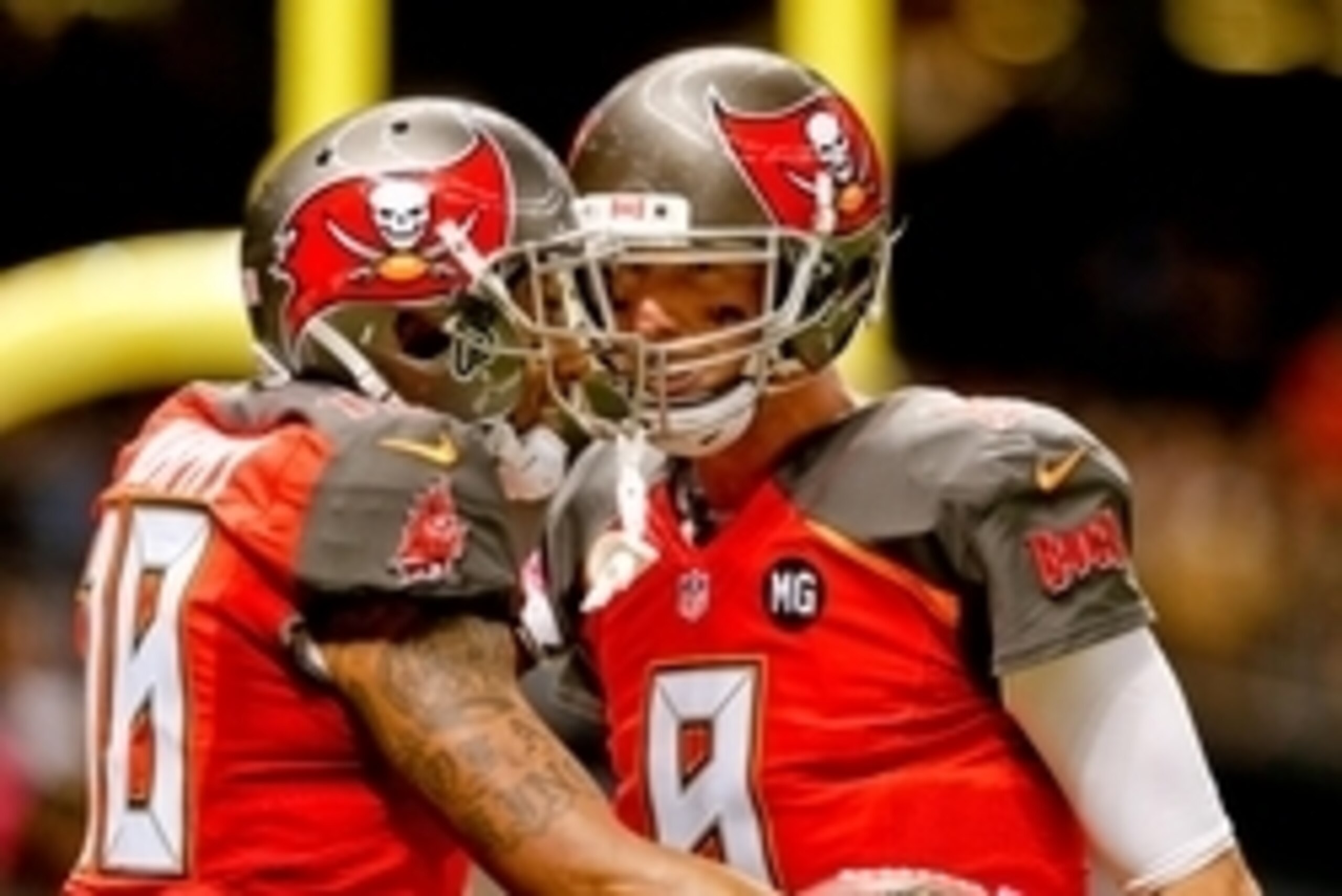 Oct 5, 2014; New Orleans, LA, USA; Tampa Bay Buccaneers quarterback Mike Glennon (8) celebrates a touchdown with wide receiver Louis Murphy (18) during the second quarter of a game against the New Orleans Saints at Mercedes-Benz Superdome. Mandatory Credi
