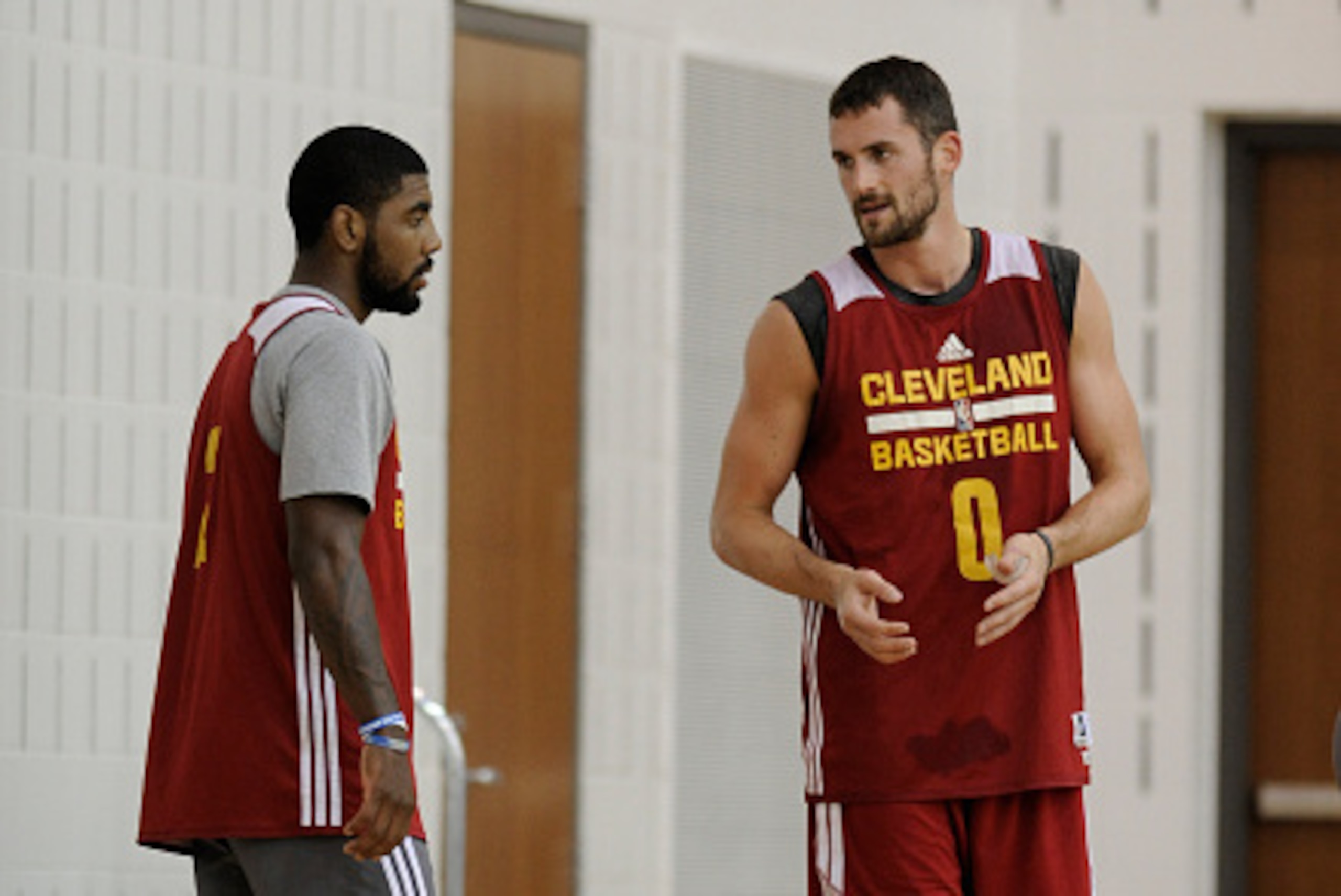 INDEPENDENCE, OH - SEPTEMBER 30: Kyrie Irving #2 and Kevin Love #0 of the Cleveland Cavaliers speak during a practice at The Cleveland Clinic Courts on September 30, 2014 in Independence, Ohio. NOTE TO USER: User expressly acknowledges and agrees that, by