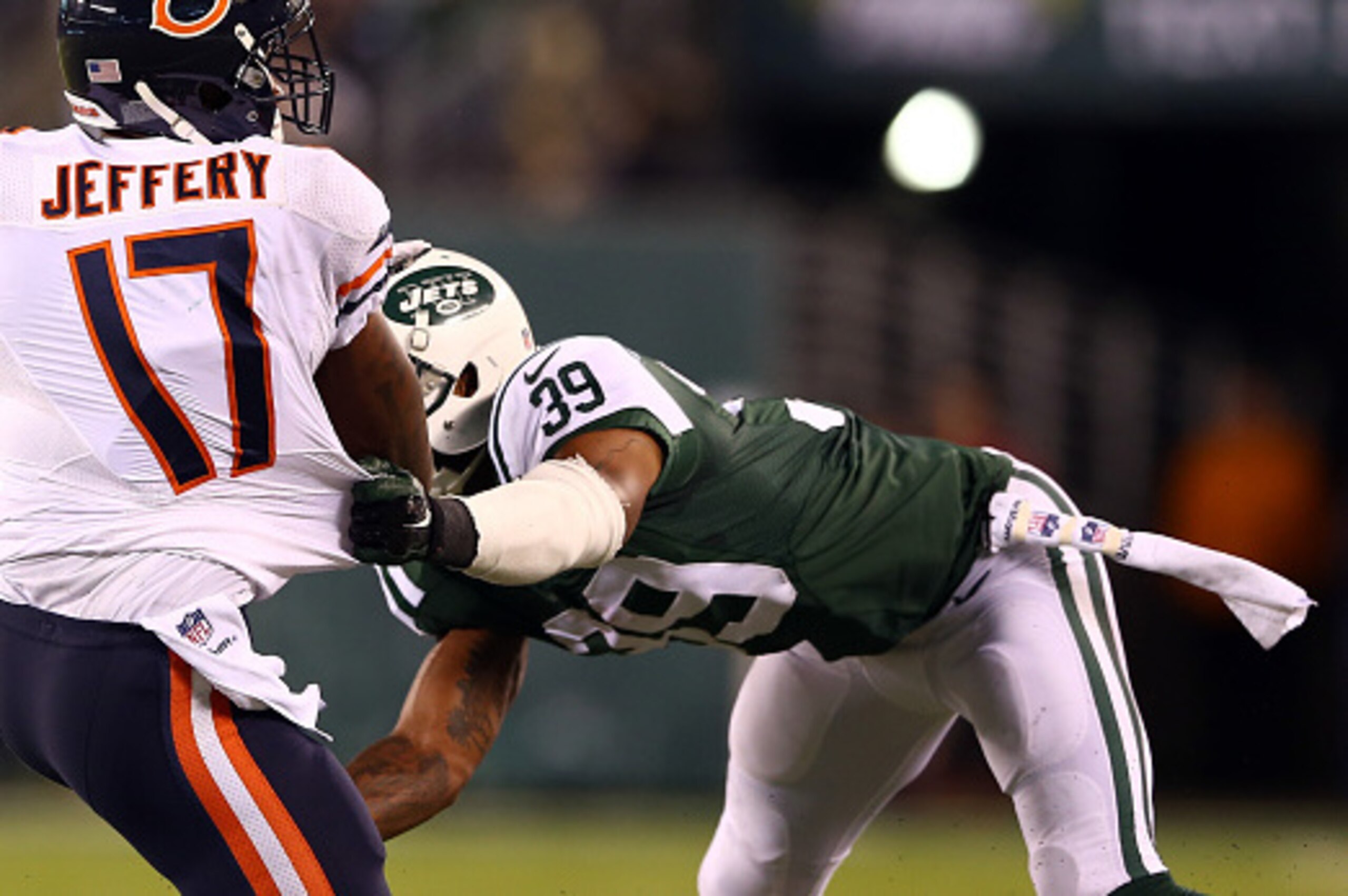 EAST RUTHERFORD, NJ - SEPTEMBER 22: Wide receiver Alshon Jeffery #17 of the Chicago Bears tries to avoid a tackle by free safety Antonio Allen #39 of the New York Jets during a game at MetLife Stadium on September 22, 2014 in East Rutherford, New Jersey. EAST RUTHERFORD, NJ - SEPTEMBER 22: Wide receiver Alshon Jeffery #17 of the Chicago Bears tries to avoid a tackle by free safety Antonio Allen #39 of the New York Jets during a game at MetLife Stadium on September 22, 2014 in East Rutherford, New Jersey.