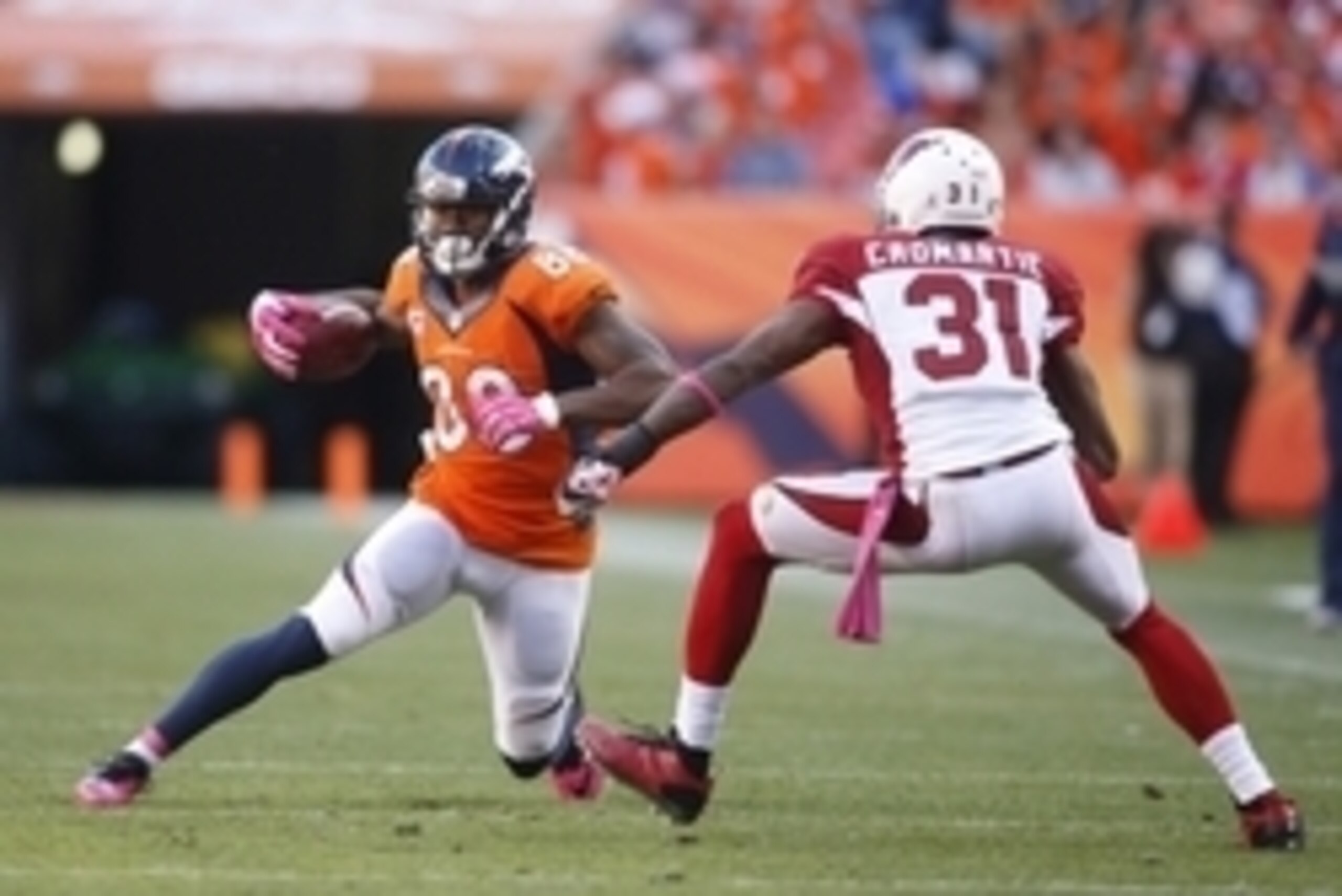 Oct 5, 2014; Denver, CO, USA; Denver Broncos wide receiver Demaryius Thomas (88) runs with the ball after catching a pass against Arizona Cardinals cornerback Antonio Cromartie (31) during the second half at Sports Authority Field at Mile High. The Bronc Oct 5, 2014; Denver, CO, USA; Denver Broncos wide receiver Demaryius Thomas (88) runs with the ball after catching a pass against Arizona Cardinals cornerback Antonio Cromartie (31) during the second half at Sports Authority Field at Mile High. The Bronc